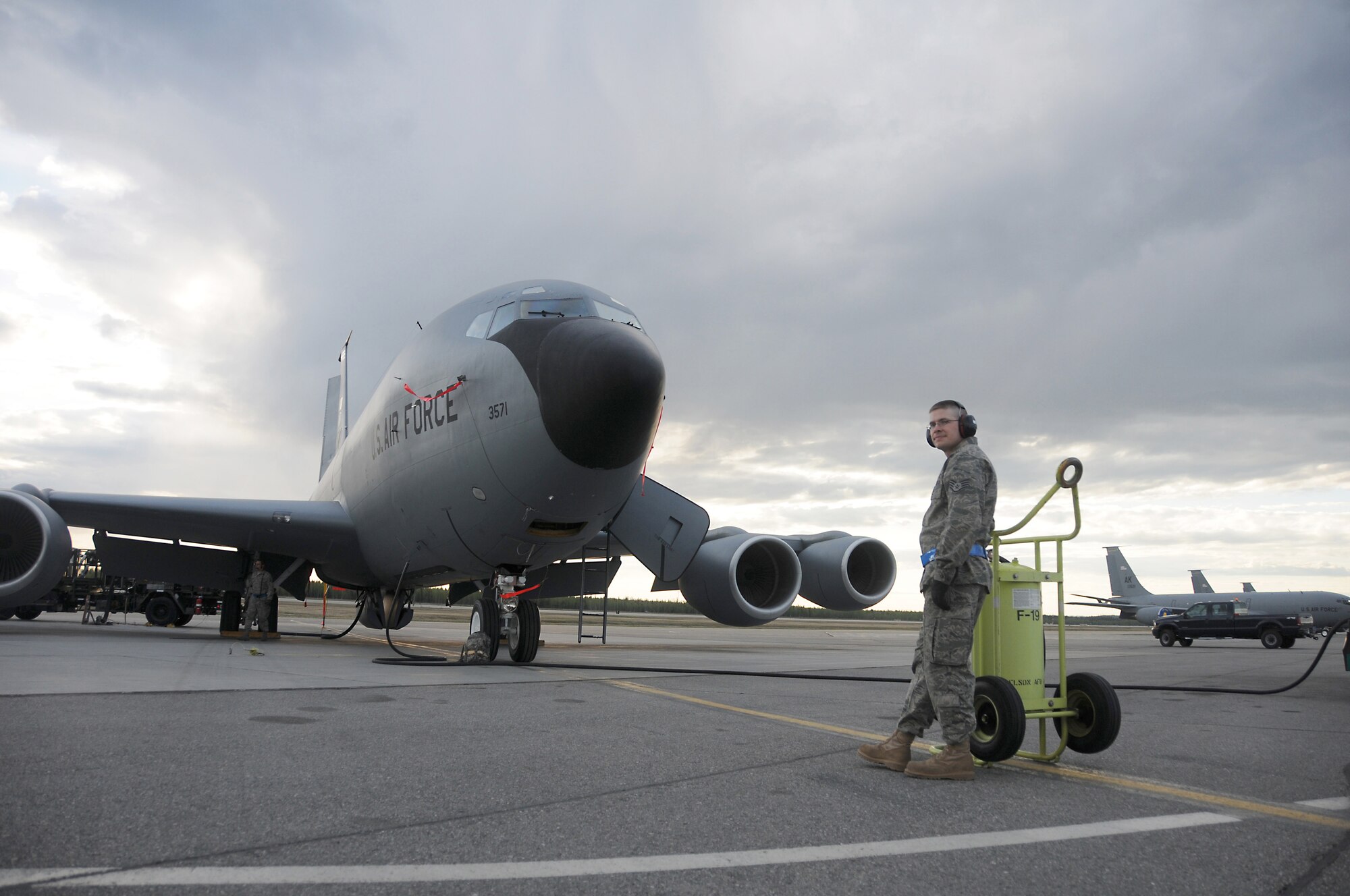 Staff Sgt. Ray Allen stands as fire guard May 18, 2010, Eielson Air Force Base, Alaska. Sergeant Allen is assigned to the 168th Air Refueling Wing and helps ensure there are no mishaps while refueling the Wings flagship KC-135 Stratotanker. The 354th Fighter Wing and 168th Air Refueling Wing are working together in an inspection that evaluates their ability to operate during real world situations. (U.S. Air Force photo/Senior Airman Monica Eusebio)