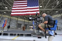 A camera crew sets up a shoot for the Lifetime Television show "Army Wives" while in a hanger on Joint Base Charleston, S.C., May18, 2010. The production crew spent two days on Joint Base Charleston, setting up and filming the episode that is to air July 18. (U.S. Air Force Photo/James M. Bowman)