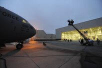 A Charleston C-17 sits on the runway while a camera crew is setting up for a early morning shoot for the Lifetime Television show "Army Wives" on Joint Base Charleston, S.C., May18, 2010. The episode is scheduled to air July 18. (U.S. Air Force Photo/James M. Bowman)