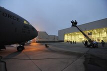 A Charleston C-17 sits on the runway while a camera crew is setting up for a early morning shoot for the Lifetime Television show "Army Wives" on Joint Base Charleston, S.C., May18, 2010. The episode is scheduled to air July 18. (U.S. Air Force Photo/James M. Bowman)