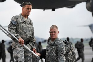 Brian McNamara and Terry Serpico stand on the staircase of a Charleston C-17 at Joint Base Charleston May 18. The Lifetime Television series Army Wives, filmed an upcoming episode at Joint Base Charleston. The episode is scheduled to air July 18. Mr. McNamara and Mr. Serpico are actors on the show.  
