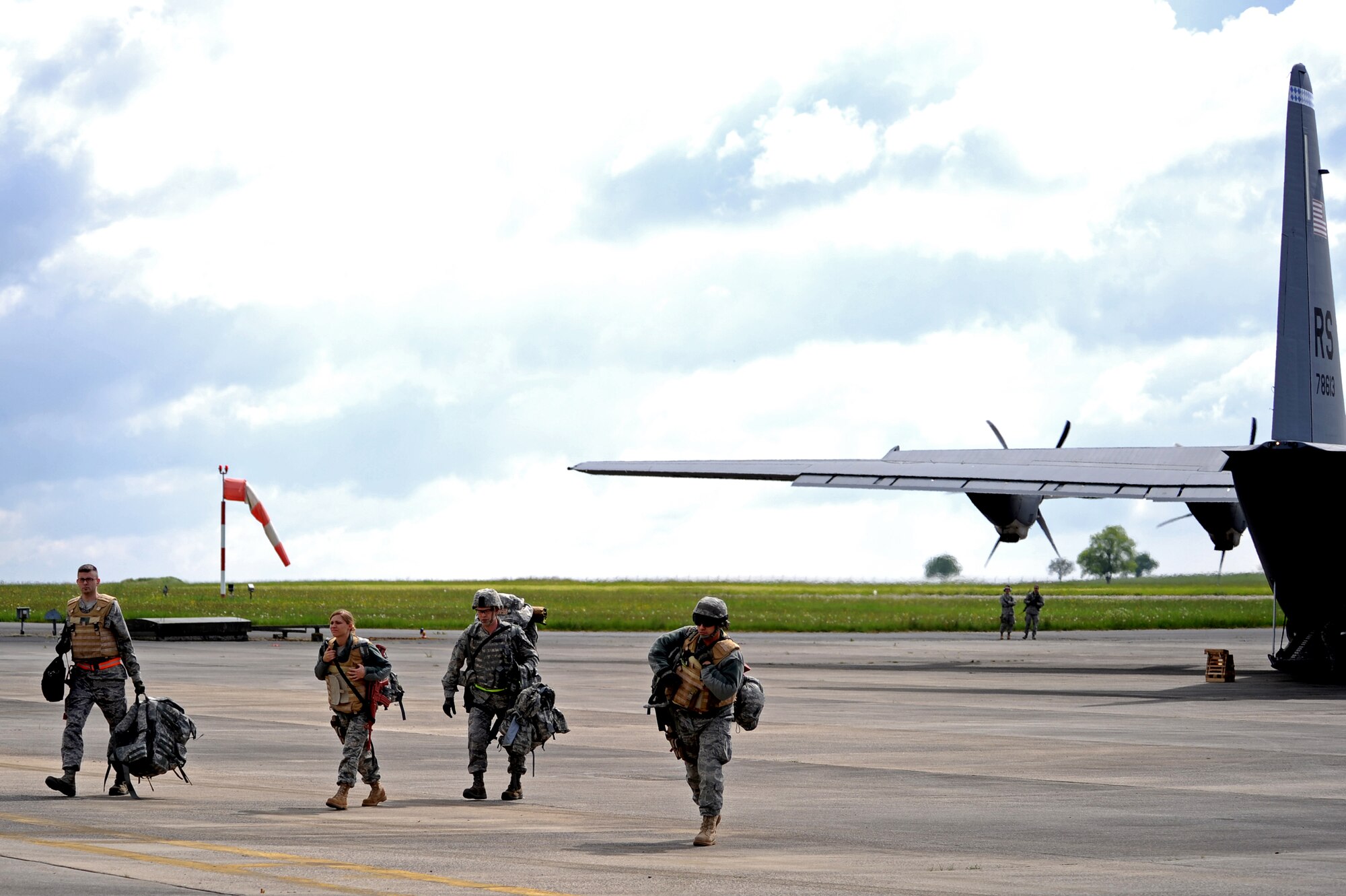 U.S. Air Force Airmen with the 435th Air Ground Operations Wing de-plane a C-130J Super Hercules during an Operational Readiness Exercise, Flugplatz Bitburg, Germany, May 17, 2010. This ORE is the third of five exercises held to prepare Airmen for an upcoming Operational Readiness Inspection. The exercise held in Bitburg consisted of over 100 personnel, spanning 30 Air Force Specialty Codes and three wings. (U.S. Air Force photo by Airman 1st Class Grovert Fuentes-Contreras)