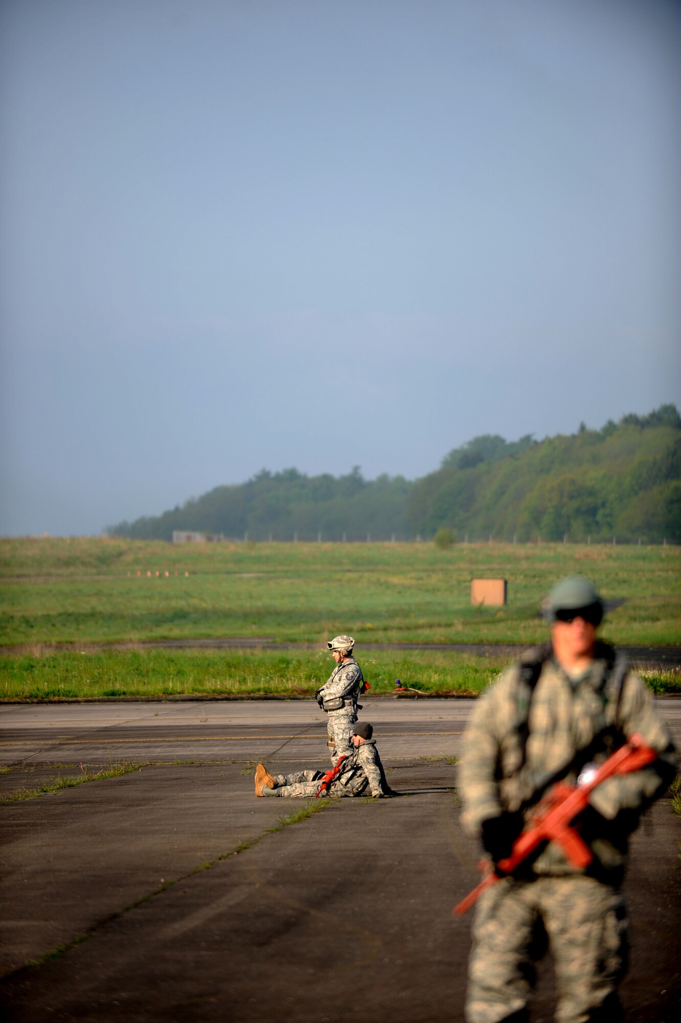 U.S. Air Force Master Sgt. Thomas Franz, airfield manager and Staff Sgt. Justin Gebhardt, ramp coordinator, both with the 435th Air Mobility Squadron, wait for the next aircraft to land during an Operational Readiness Exercise, Flugplatz Bitburg, Germany, May 17, 2010. This ORE is the third of five exercises held to prepare Airmen for an upcoming Operational Readiness Inspection. The exercise held in Bitburg consisted of over 100 personnel, spanning 30 Air Force Specialty Codes and three wings. (U.S. Air Force photo by Airman 1st Class Grovert Fuentes-Contreras)