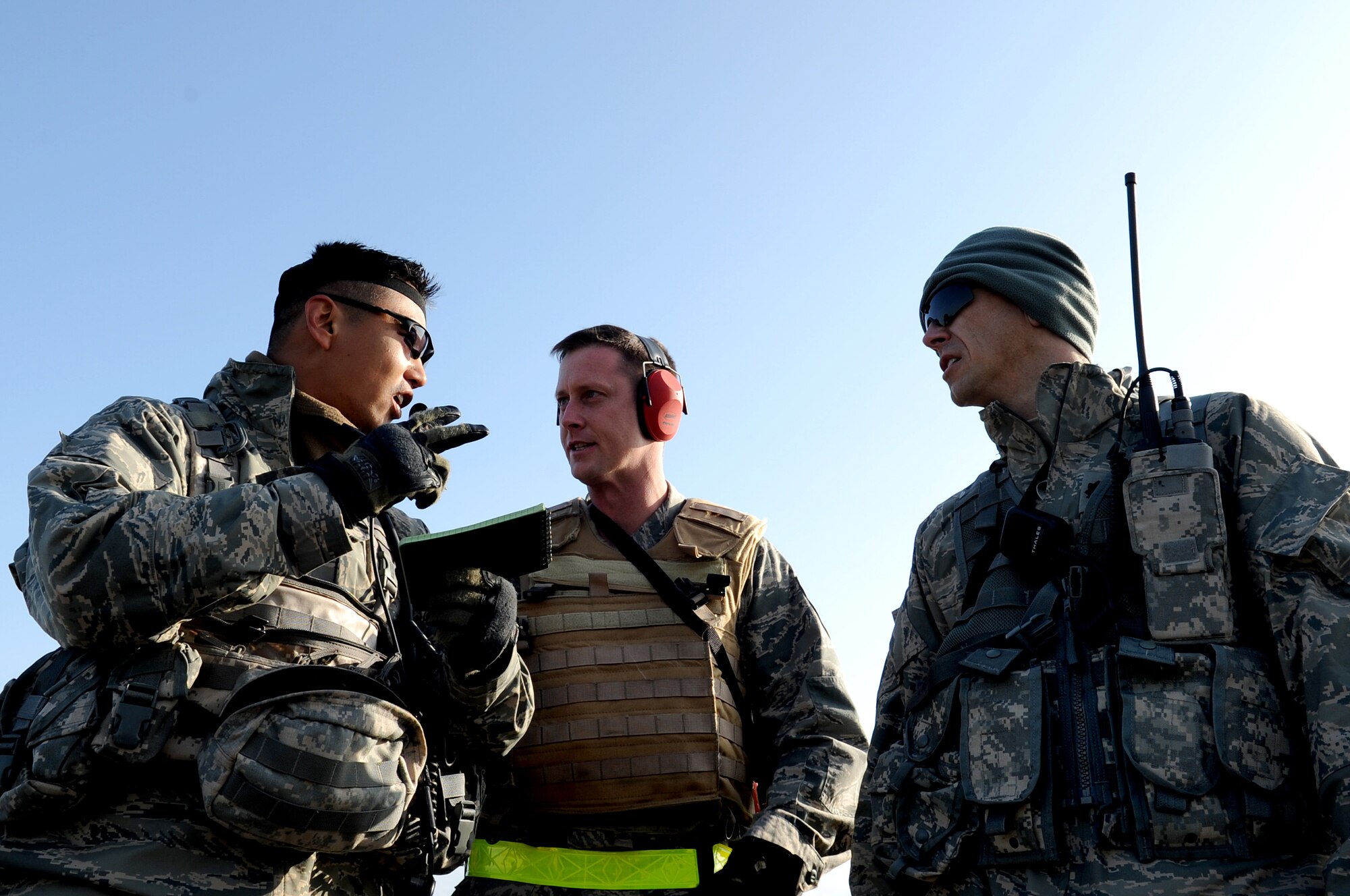 (from left) U.S. Air Force Capt. Walter Gray, Master Sgt. Kody Pruitt, and Lt. Col Charles Schlegel, all from the 435th Air Ground Operations Wing, strategize for the incoming C-130J Super Hercules during an Operational Readiness Exercise, Flugplatz Bitburg, Germany, May 17, 2010. This ORE is the third of five exercises held to prepare Airmen for an upcoming Operational Readiness Inspection. The exercise held in Bitburg consisted of over 100 personnel, spanning 30 Air Force Specialty Codes and three wings. (U.S. Air Force photo by Airman 1st Class Grovert Fuentes-Contreras)