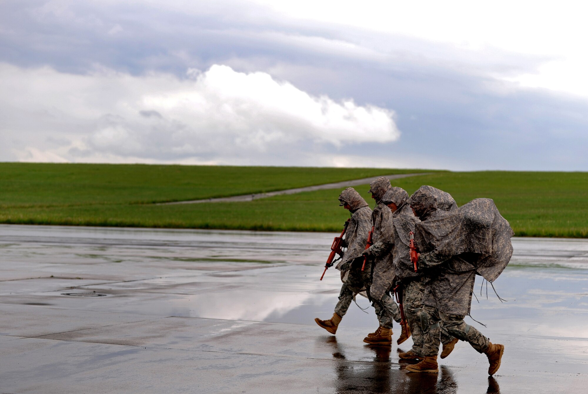 U.S. Air Force Airmen with the 435th Air Ground Operations Wing walk to their rally point after assessing an airfield during an Operational Readiness Exercise, Flugplatz Bitburg, Germany, May 17, 2010. This ORE is the third of five exercises held to prepare Airmen for an upcoming Operational Readiness Inspection. The exercise held in Bitburg consisted of over 100 personnel, spanning 30 Air Force Specialty Codes and three wings. (U.S. Air Force photo by Airman 1st Class Grovert Fuentes-Contreras)