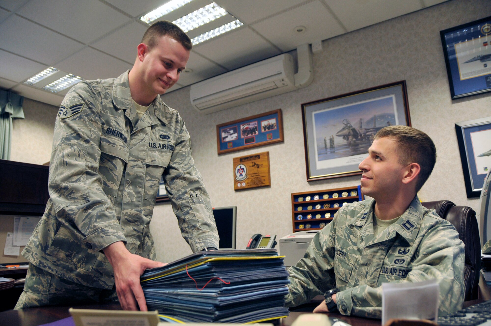 Senior Airman Jedediah Sherwood, 48th Fighter Wing chief enlisted administration technician, drops off staff summary packages to Capt. Patrick Kucera, 48th Fighter Wing executive officer, at the wing headquarters building May 19. Airman Sherwood was nominated for a liberty spotlight because he epitomizes 'Service Before Self'.
