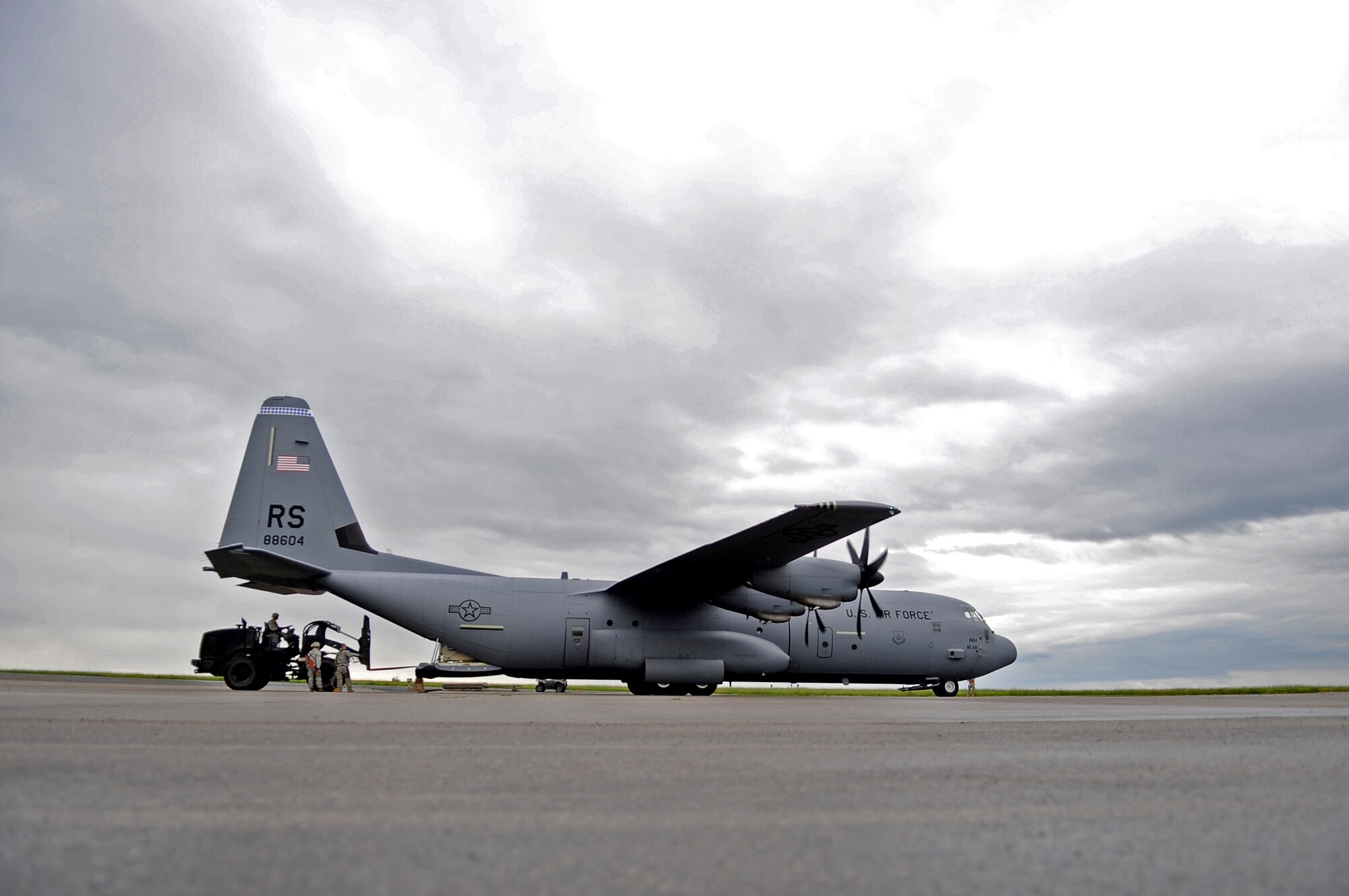 U.S. Air Force Airmen with the 435th Air Ground Operations Wing work together to unload cargo from a C-130J Super Hercules during an Operational Readiness Exercise, Flugplatz Bitburg, Germany, May 17, 2010. This ORE is the third of five exercises held to prepare Airmen for an upcoming Operational Readiness Inspection. The exercise held in Bitburg consisted of over 100 personnel, spanning 30 Air Force Specialty Codes and three wings. (U.S. Air Force photo by Airman 1st Class Grovert Fuentes-Contreras)