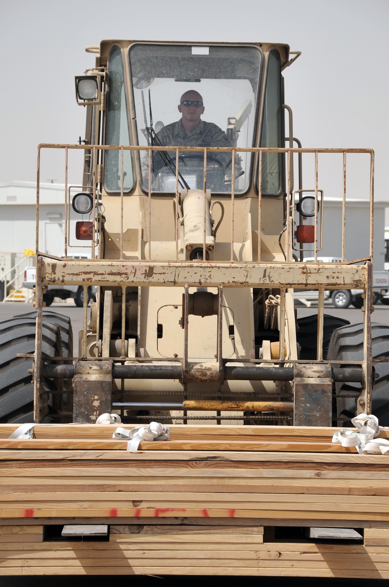Senior Airman Nicholas Worrell, air transportation journeyman with the 380th Expeditionary Logistics Readiness Squadron Air Terminal Operations Center, drives an extreme terrain forklift in the ATOC yard during operations for the 380th Air Expeditionary Wing at a non-disclosed base in Southwest Asia on May 19, 2010. Airman Worrell is deployed from the 89th Aerial Port Squadron at Joint Base Andrews, Md., and his hometown is Robins, Iowa. (U.S. Air Force Photo/Master Sgt. Scott T. Sturkol/Released)
