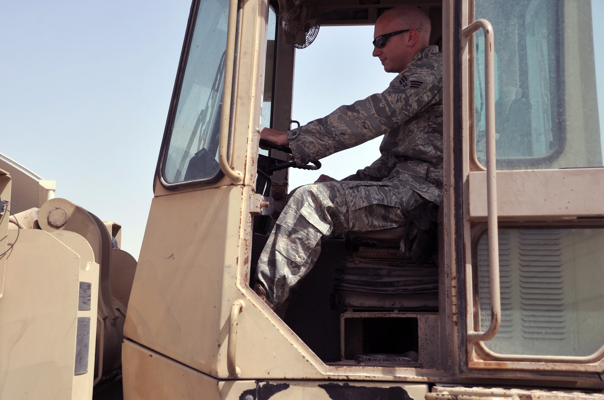 Senior Airman Nicholas Worrell, air transportation journeyman with the 380th Expeditionary Logistics Readiness Squadron Air Terminal Operations Center, drives an extreme terrain forklift in the ATOC yard during operations for the 380th Air Expeditionary Wing at a non-disclosed base in Southwest Asia on May 19, 2010. Airman Worrell is deployed from the 89th Aerial Port Squadron at Joint Base Andrews, Md., and his hometown is Robins, Iowa. (U.S. Air Force Photo/Master Sgt. Scott T. Sturkol/Released)