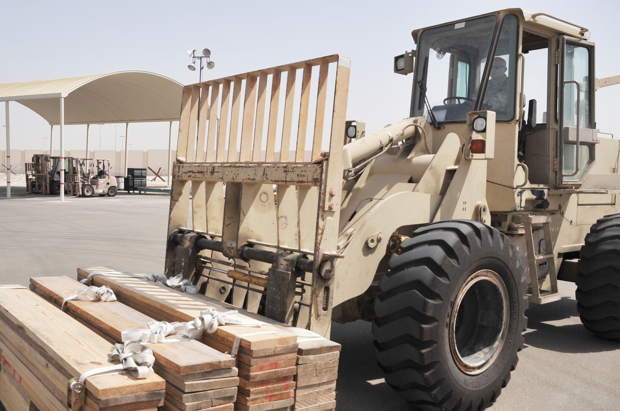 Senior Airman Nicholas Worrell, air transportation journeyman with the 380th Expeditionary Logistics Readiness Squadron Air Terminal Operations Center, drives an extreme terrain forklift in the ATOC yard during operations for the 380th Air Expeditionary Wing at a non-disclosed base in Southwest Asia on May 19, 2010. Airman Worrell is deployed from the 89th Aerial Port Squadron at Joint Base Andrews, Md., and his hometown is Robins, Iowa. (U.S. Air Force Photo/Master Sgt. Scott T. Sturkol/Released)