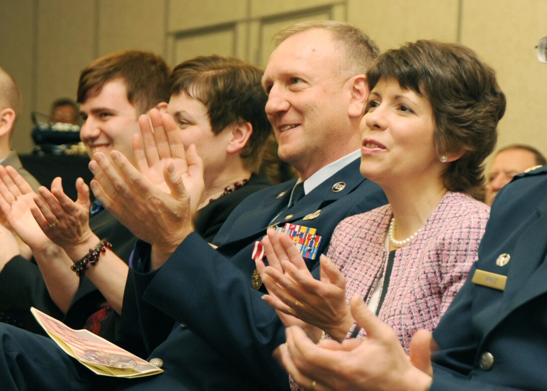 CMSgt Runyan applauds a speech at his retirement ceremony