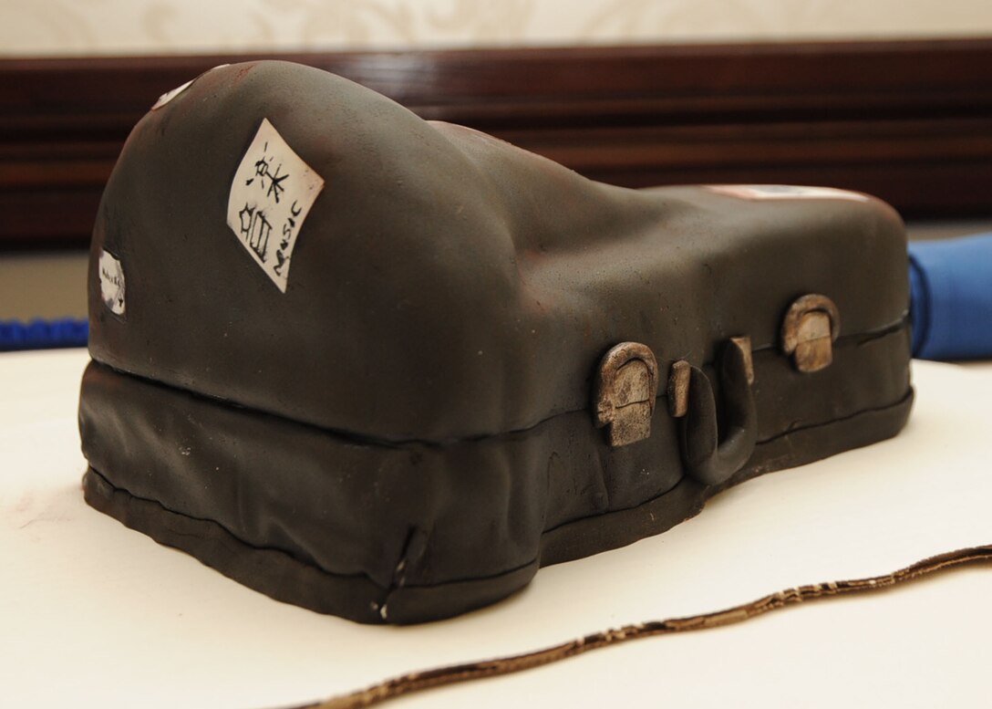 CMSgt Runyan's retirement ceremony cake - shaped like a Tuba case