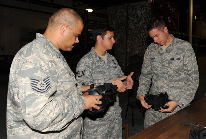 SEYMOUR JOHNSON AIR FORCE BASE, N.C. -- Staff Sgt. Christopher Hester explains how the M-50 Joint Service General Purpose Mask works May 19, 2010. The 4th Logistics Readiness Squadron received a shipment of the new masks a month ago which are now being issued to more than 3,200 Airmen here. Sergeant Hester, 4th Civil Engineer Squadron emergency management technician, hails from Montgomery, Ala. (U.S. Air Force photo/Senior Airman Gino Reyes)