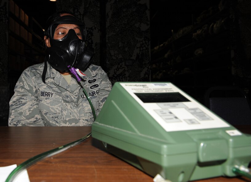 SEYMOUR JOHNSON AIR FORCE BASE, N.C. -- Staff Sgt. Kennethea Berry simulates chewing gum while performing an M-50 Joint Service General Purpose Mask fit test here May 19, 2010. The M-50 JSGPM is the new standard gas mask being issued across all military branches. Sergeant Berry, 4th Fighter Wing paralegal, hails from Nashville, Tenn. (U.S. Air Force photo/Senior Airman Gino Reyes)