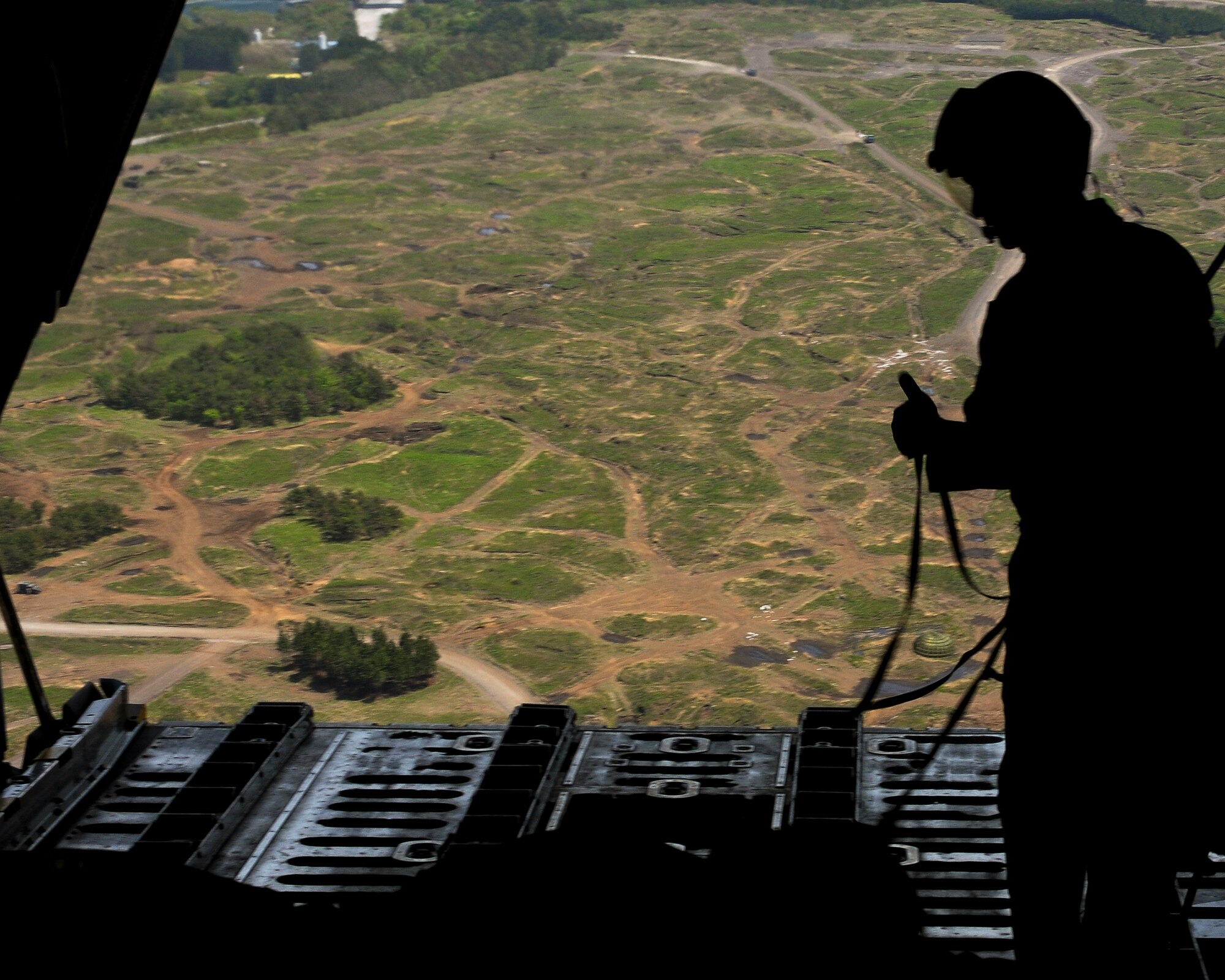 A loadmaster from the 374th Operations Support Squadron gives the OK during the bilateral Joint Air Delivery Inspection training May 6, 2010, at Yokota Air Base, Japan. The JAI event was a way for Japan Air Self Defense Force airmen to learn how loads are inspected and delivered in preparation for Red Flag-Alaska. (U.S. Air Force photo/Airman 1st Class Sean Martin)