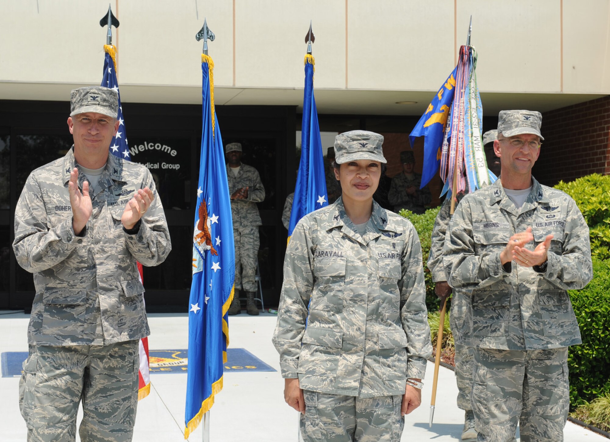 SEYMOUR JOHNSON AIR FORCE BASE, N.C. – Col. Leslie Claravall (Center) assumes command of the 4th Medical Group from Col. Stephen Higgins during a change of command ceremony May 14, 2010. Col. Patrick Doherty, 4th Fighter Wing commander, presided over the ceremony. (U.S. Air Force photo/Senior Airman Whitney Lambert) 