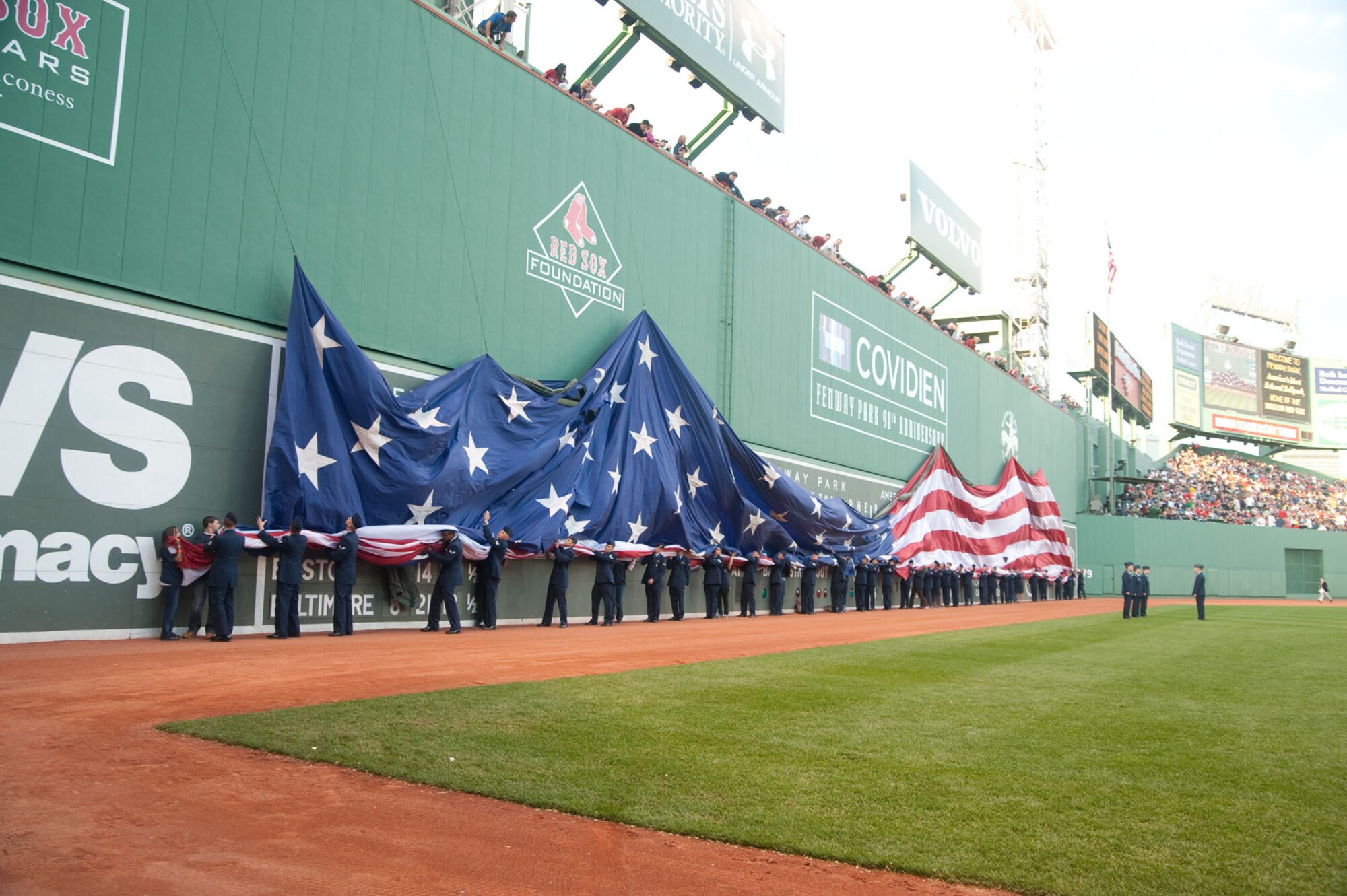 BOSTON - Airmen from Hanscom Air Force Base retrieve the flag during a recent flag detail at Fenway Park during a Red Sox game. (U.S. Air Force photo by Mark Herlihy)
