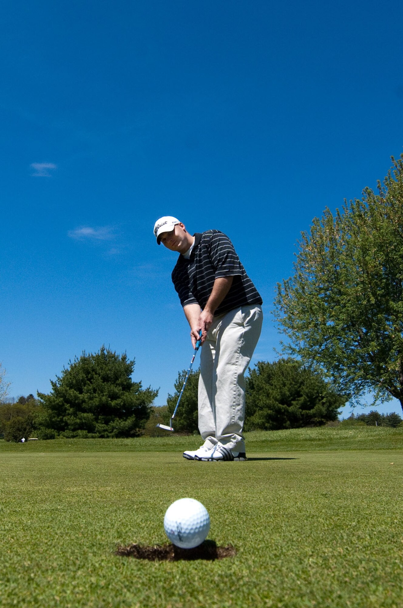 BEDFORD, Mass. – Staff Sgt. James Annison makes a put during the Police Week Charity Golf Tournament. The tournament was held May 13 at the Patriot Golf Course. A portion of the proceeds raised during the tournament were donated to the Air Force Security Police Association and the Domestic Violence Services Network.(U.S. Air Force photo by Rick Berry)