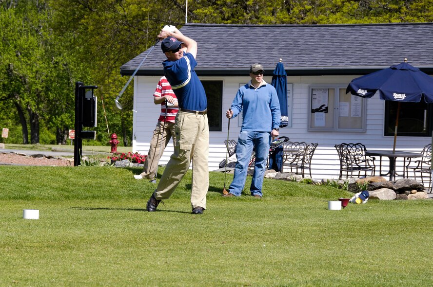BEDFORD, Mass. - Lt. Col. Chris Echols, 66th Security Forces Squadron commander, tees off during the Police Week Charity Golf Tournament. The tournament was held May 13 at the Patriot Golf Course. A portion of the proceeds raised during the tournament were donated to the Air Force Security Police Association and the Domestic Violence Services Network. (U.S. Air Force photo by Rick Berry)