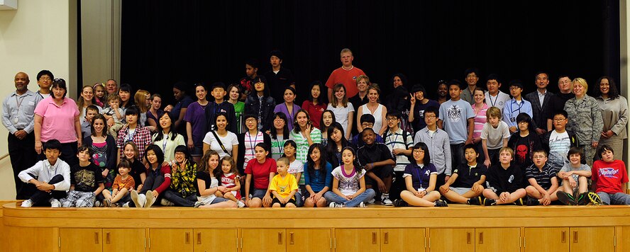 Participants in the English Camp exchange program gather for a group photo at Osan Middle School May 20, 2010. The photo followed the recognition of Korean exchange students in the English Camp graduation ceremony. The graduation recognized 23 Korean Exchange students hosted by U.S. families for three days of educational and cultural immersion. (U.S. Air Force photo/Staff Sgt. Eunique Stevens) 