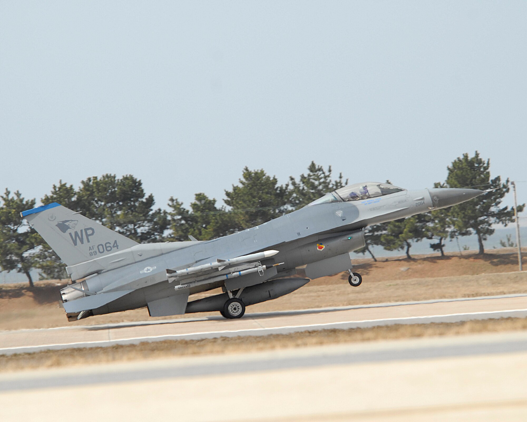 KUNSAN AIR BASE, Republic of Korea--An F-16 Fighting Falcon takes off here at Kunsan AB, ROK. The 8th Fighter Wing tested its flying and maintenance operations during surge operations here May 17. The purpose of the surge operation was to test the skills and wartime capabilities of the operators, maintainers and supporting agencies of the Wolf Pack over a 14-hour window and to simulate pilots' wartime flying rates. A successfully generated flight is considered to be a single sortie. (U.S. Air Force photo/Staff Sgt Darnell Cannady)