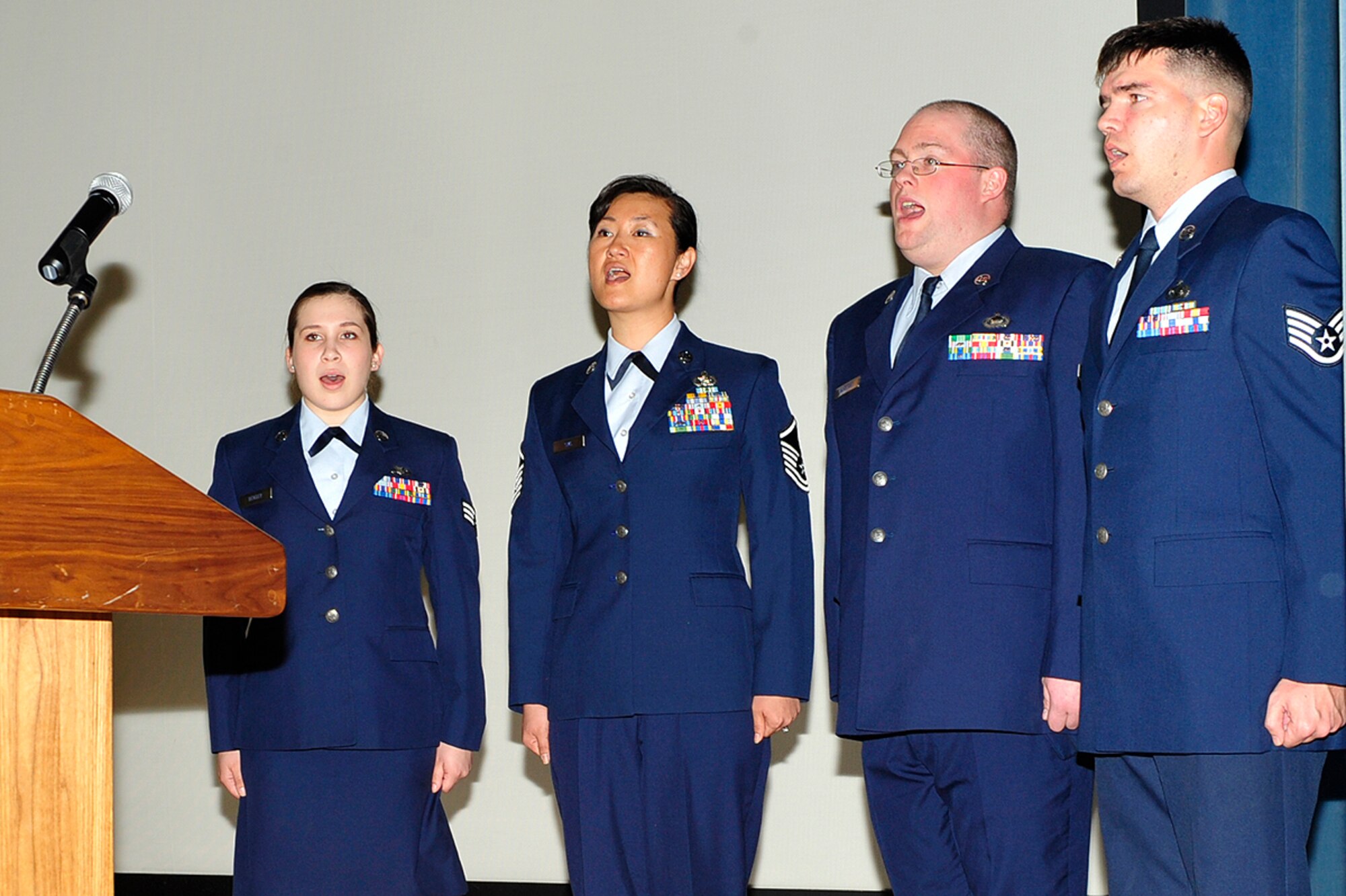 The Osan Singing Stripes perform the Korean and U.S. national anthems during an awards ceremony here April 29. The Singing Stripes are a volunteer group made up of enlisted members from different organizations around the base. (U.S. Air Force photo/Staff Sgt. Eunique Stevens)