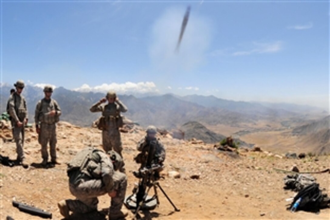 U.S. Army soldiers fire a round from the 60mm mortar launcher during training at Outpost Loyalty, Nangarech, Afghanistan, May 15, 2010. The soldiers are assigned to 4th Infantry Division's Company D, 1-102nd Infantry Regiment, Task Force Mountain Warrior.