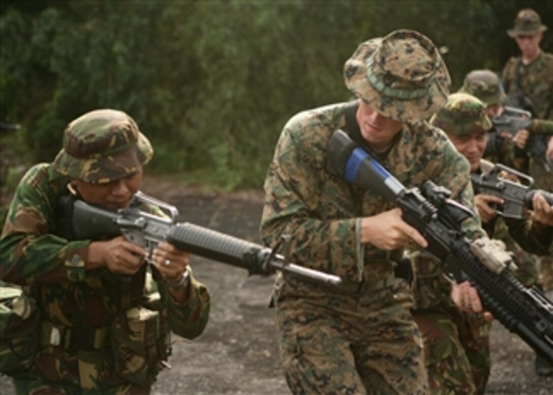 U.S. Landing Force Marines participating in Cooperation Afloat Readiness and Training Brunei 2010 share Military Operations on Urban Terrain techniques with Royal Brunei Landing Force members at Rimba Air Base, Brunei, on May 4, 2010.  Cooperation Afloat Readiness and Training is a series of bilateral exercises held annually in Southeast Asia to strengthen relationships and to enhance force readiness.  