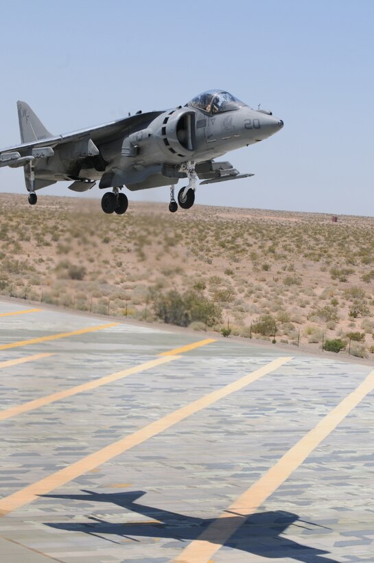 Capt. Luke Jacobs, Marine Attack Squadron 513 pilot, vertically lands an AV-8B Harrier at Auxiliary Airfield 2 on the Barry M. Goldwater Range in Arizona May 20, 2010. The Nightmares used the airfield, which simulates a ship’s landing deck, to get their aircraft carrier landing qualification before their support of Exercise Dawn Blitz aboard the USS Bonhomme Richard May 24-28, 2010. The exercise is held to provide a training scenario that includes naval, aviation and ground elements all at once. While participating in the exercise, the Nightmares will provide close-air support for the 1st Marine Expeditionary Force.