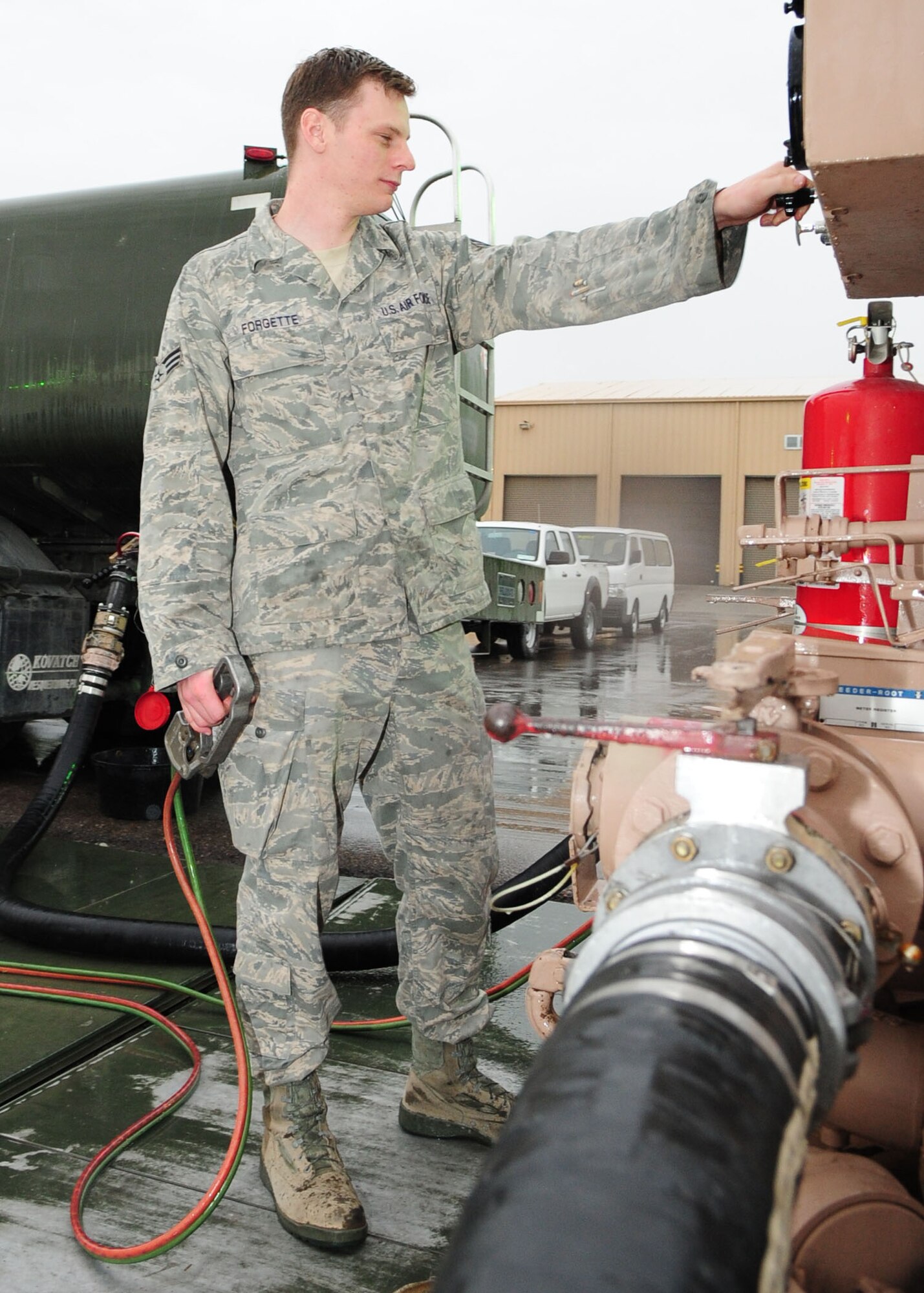 Senior Airman Aaron Forgette, 376th Expeditionary Logistics Readiness Squadron fuels distribution operator, pumps JP-8 fuel into an R-11 Refueling unit May 21, 2010, at the Transit Center at Manas, Kyrgyzstan, prior to departing for the flight line to refuel aircraft supporting combat operations in Afghanistan. Airman Forgette is deployed from the 97th Logistics Readiness Squadron, Altus Air Force Base, Okla., and hails from Amarillo, Texas. (U.S. Air Force photo/ Senior Airman Nichelle Anderson/ released)