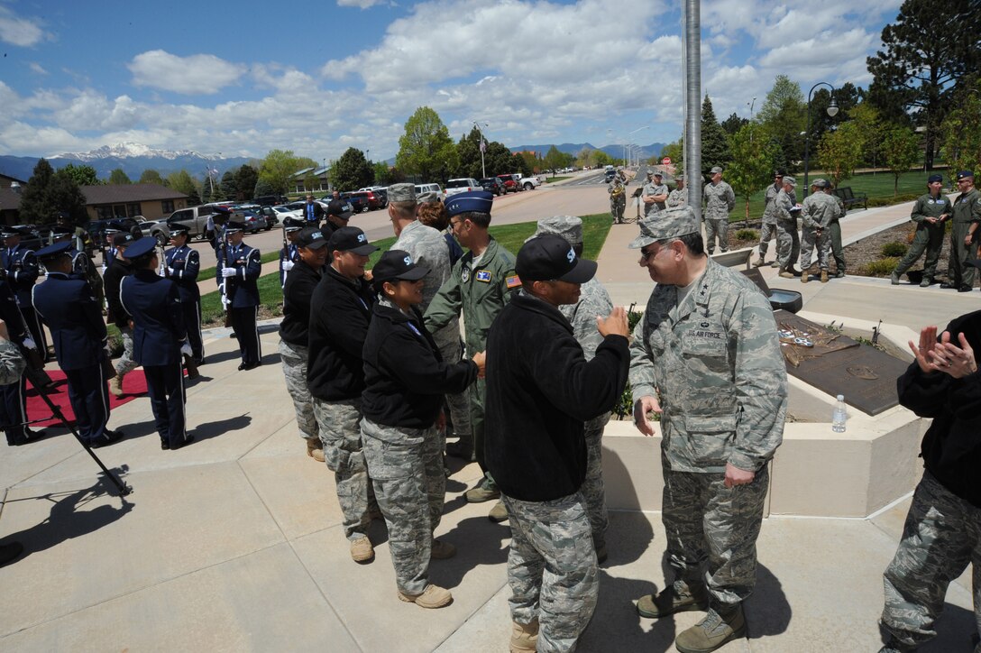 Members of the Space and Missile Systems Center's Guardian Challenge 2010 team receive a warm welcome by the Air Force Space Command's leadership at the Arrival Ceremony at Peterson Air Force Base, Colo., 20 May. (Photos by Lou Hernandez)