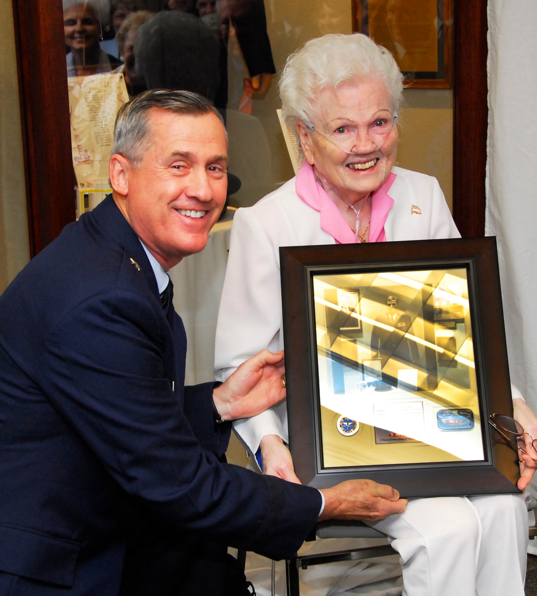 82nd Training Wing Commander Brig. Gen. O.G. Mannon presents a Sheppard photo memento plaque to Mrs. Theresa Teague, widow of the late Sheppard Hall of Heroes Honoree Senior Master Sgt. Thurman Teague, during the Sheppard Hall of Heroes ceremony at the Heritage Center at Sheppard Air Force Base, Texas, May 21, 2010. Three Airmen were honored at the ceremony for their service which spanned conflicts from World War II to Desert Storm. (U.S. Air Force photo/Harry Tonemah)