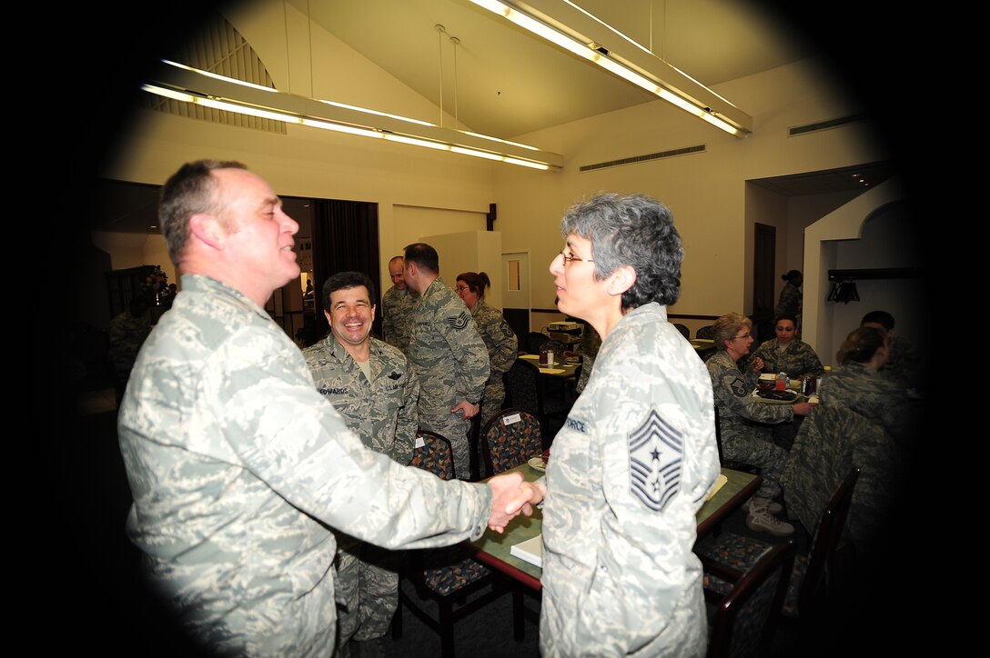Command Chief Master Sgt. Sandra Santos, the highest-raniking enlisted member in the 932nd Airlift Wing, shared her thoughts on life and how women have served their country.  Thanking her for her service is the 932nd Maintenance Group commander, Col. James McDonnell, and the commander of the 932nd Airlift Wing, Col. William Edwards, Jr.  (U.S. Air Force photo/Maj. Stan Paregien)