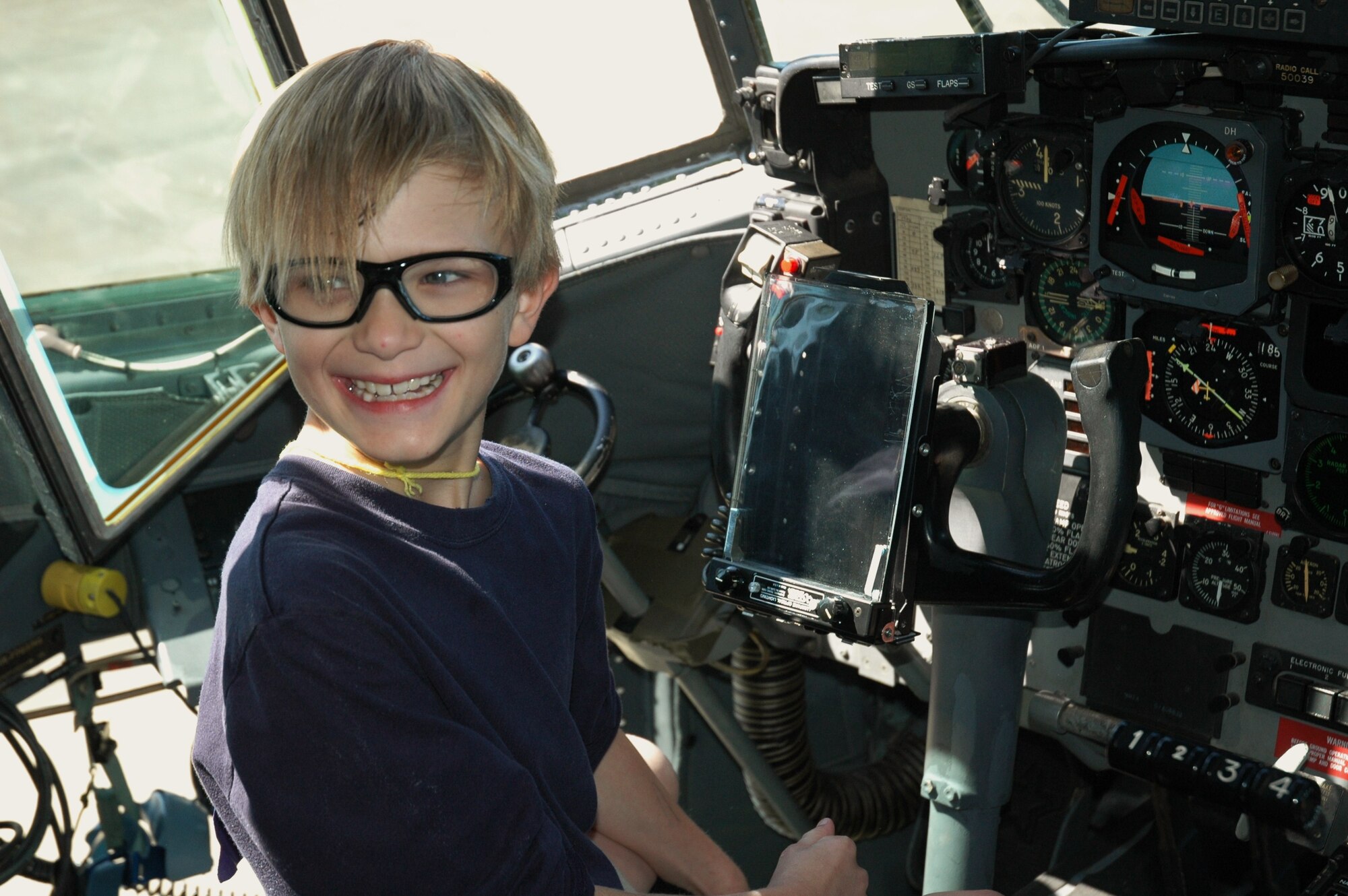 'Captain" Donovan York expresses his delight after a few moments of getting to sit in the pilot's seat of a C-130H during Aerospace Adventures Day at Maxwell Air Force Base. (Air Force photo/Gene H. Hughes)