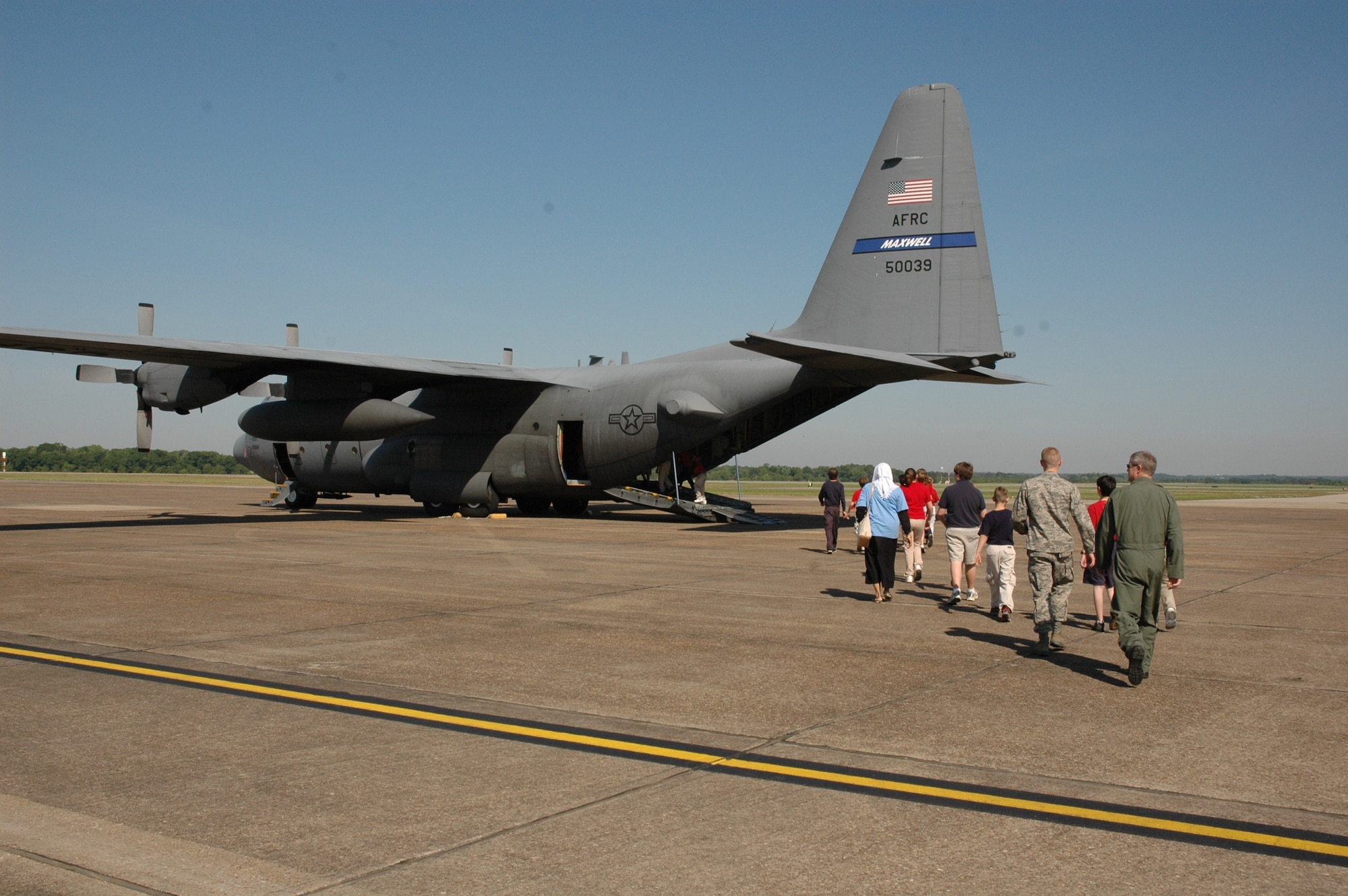Flowers Elementary Students make their way towards a C-130H during Aerospace Adventures Day. (Air Force photo/Gene H. Hughes)