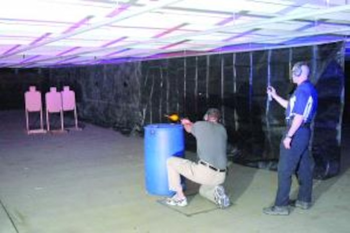 A Treasury officer shoots in competition on the range during National Police Week on May 13. The Pistol Shoot drew competitors from a wide range of police departments and security forces on base. (U.S. Air Force photo by Todd Cromar)