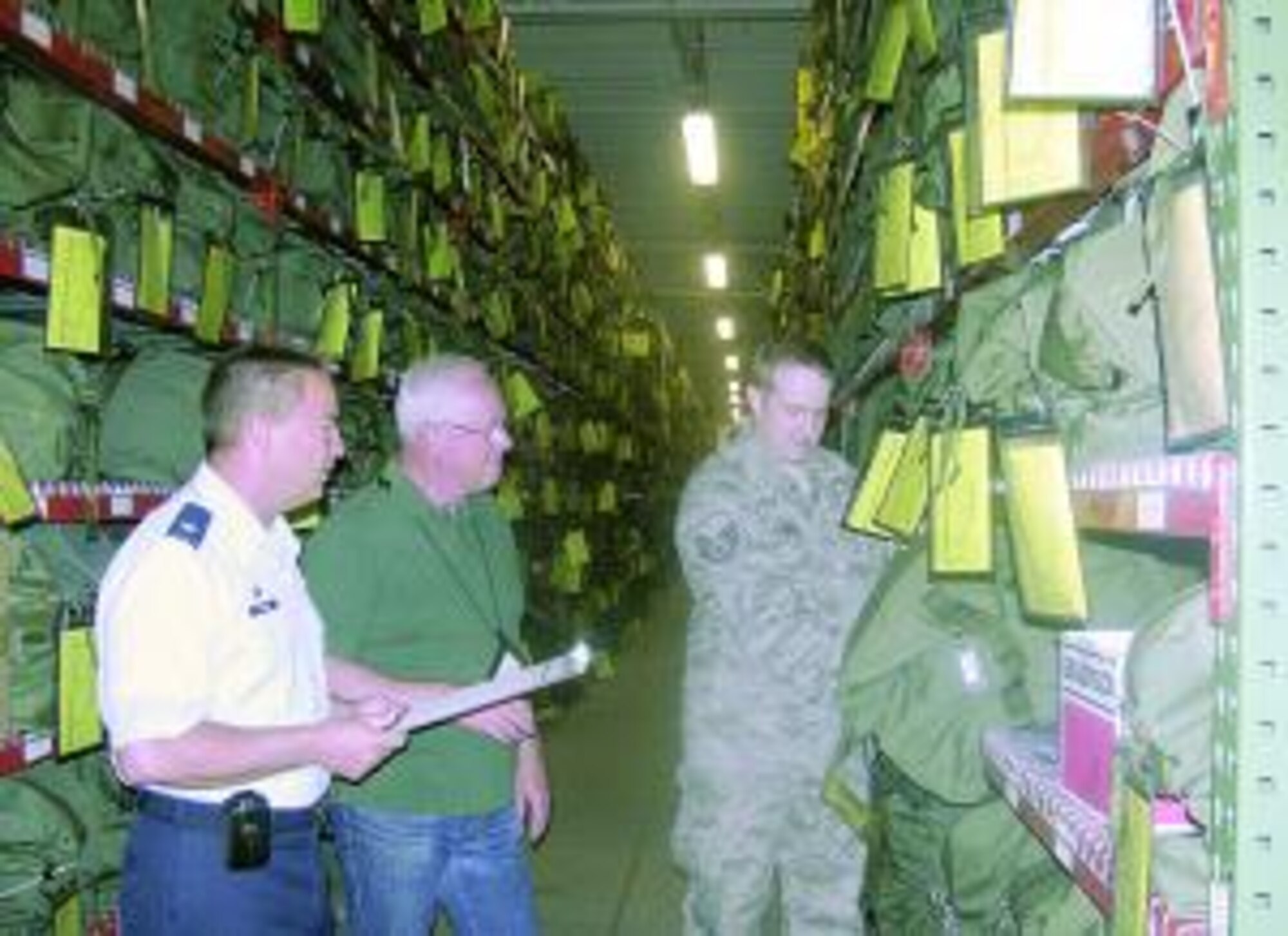 Lt. Col. Danny "Chip" Johnson (left), 75th Logistics Readiness Squadron commander, reviews a mobility bag with Staff Sgt. Michael Johnson (right) and Michael Olsen, Mobility Element A Bag manager May 17. Johnson was recently awarded the Gen. Thomas P. Gerrity Award at the AFMC level for Logistics Grade Officer of the Year. In typical fashion, Johnson gave a lot of credit to the personnel in his squadron. He was nominated while on leave by his logistics manager and was surprised and honored at the distinction. 