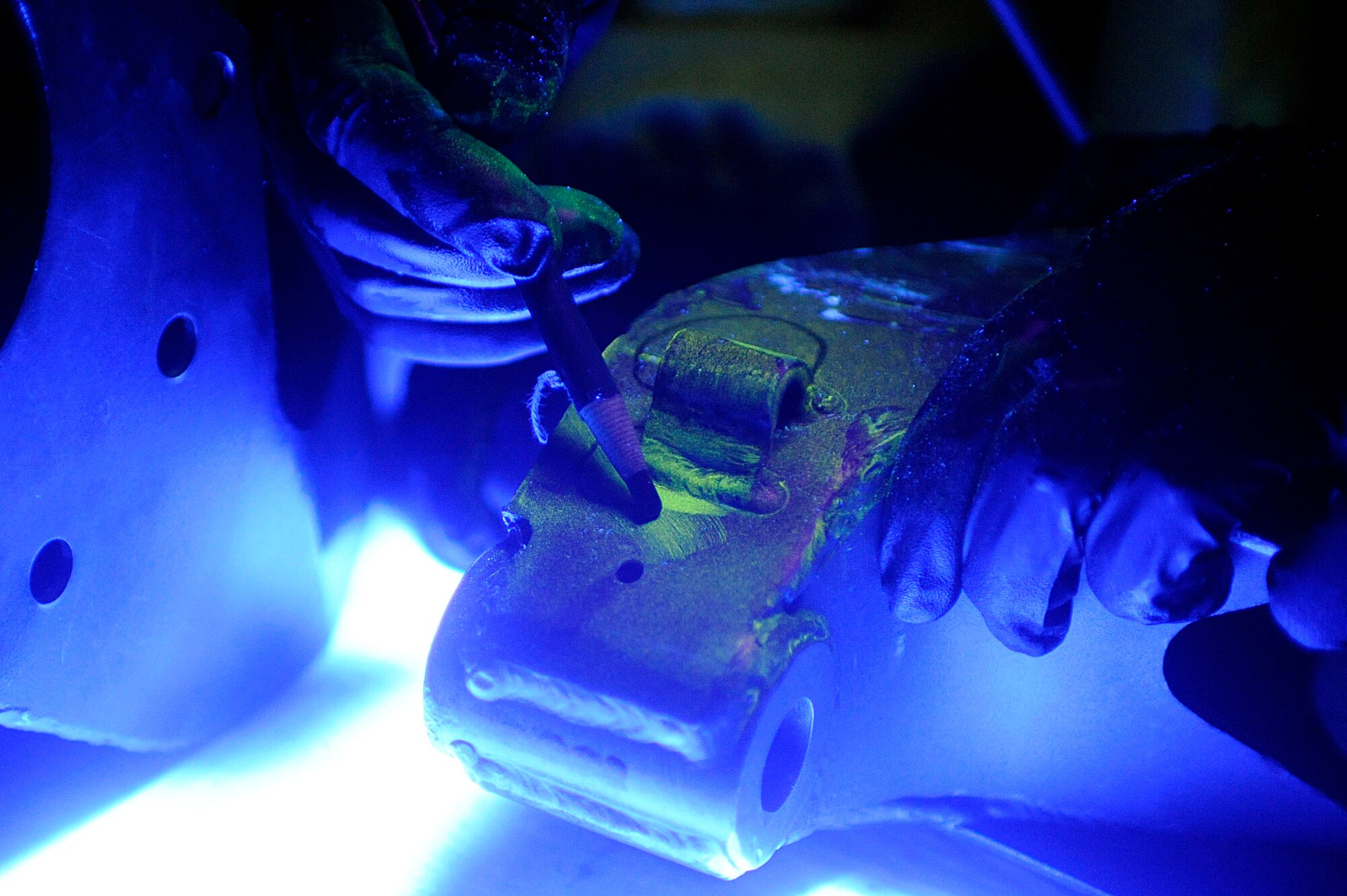 ELLSWORTH AIR FORCE BASE, S.D. – Staff Sgt. Ehud Torres, 28th Maintenance Squadron non-destructive inspection technician, marks a cracked area, May 20. Sergeant Torres is inspecting a forward support bracket. (U.S. Air Force photo/Airman 1st Class Matthew Flynn)