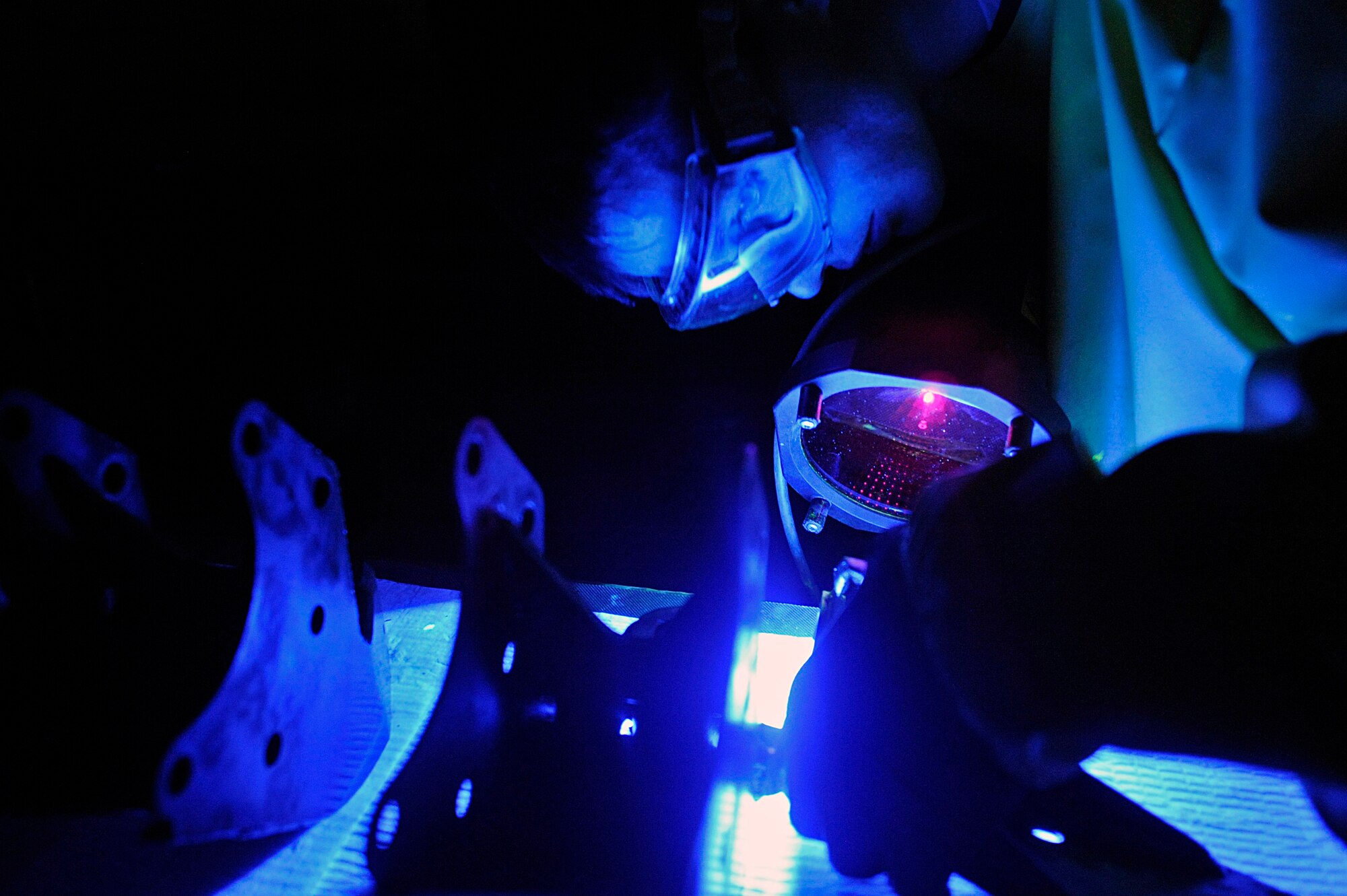 ELLSWORTH AIR FORCE BASE, S.D. – Airman 1st Class Evan Bryant, 28th Maintenance Squadron non-destructive inspection technician, examines a forward support bracket for cracks, May 20. Airman Evans inspected four forward support brackets and four lower links during this inspection. (U.S. Air Force photo/Airman 1st Class Matthew Flynn)