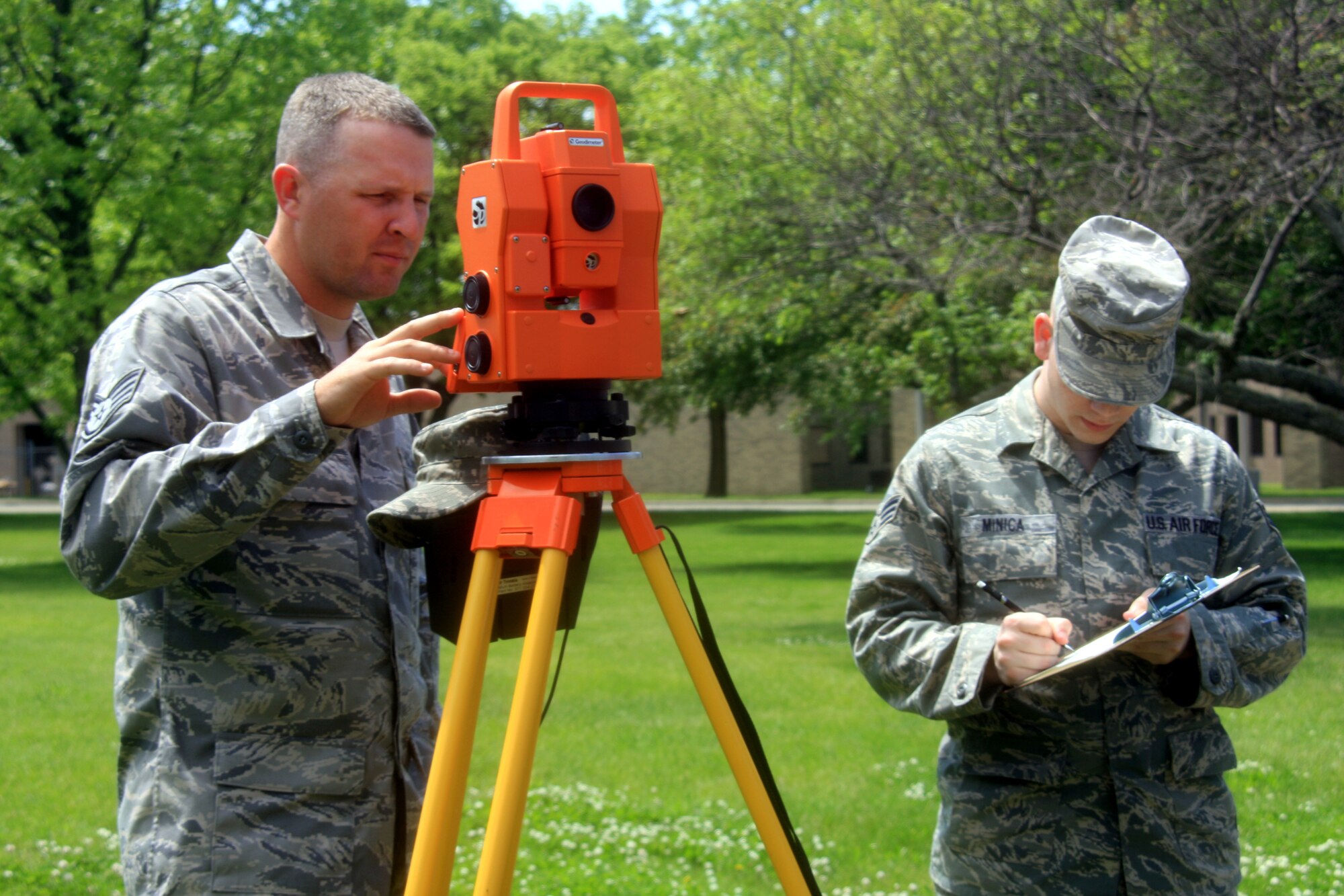 WRIGHT-PATTERSON AIR FORCE BASE, Ohio – Staff Sgt. Brian Sudkamp and Senior Airman Ryan Minica, both from the 445th Civil Engineer Squadron, create a map of a crash scene for crash investigators as part of their training during the May 16 unit training assembly.  (U.S. Air Force photo/Senior Airman Mikhail Berlin)