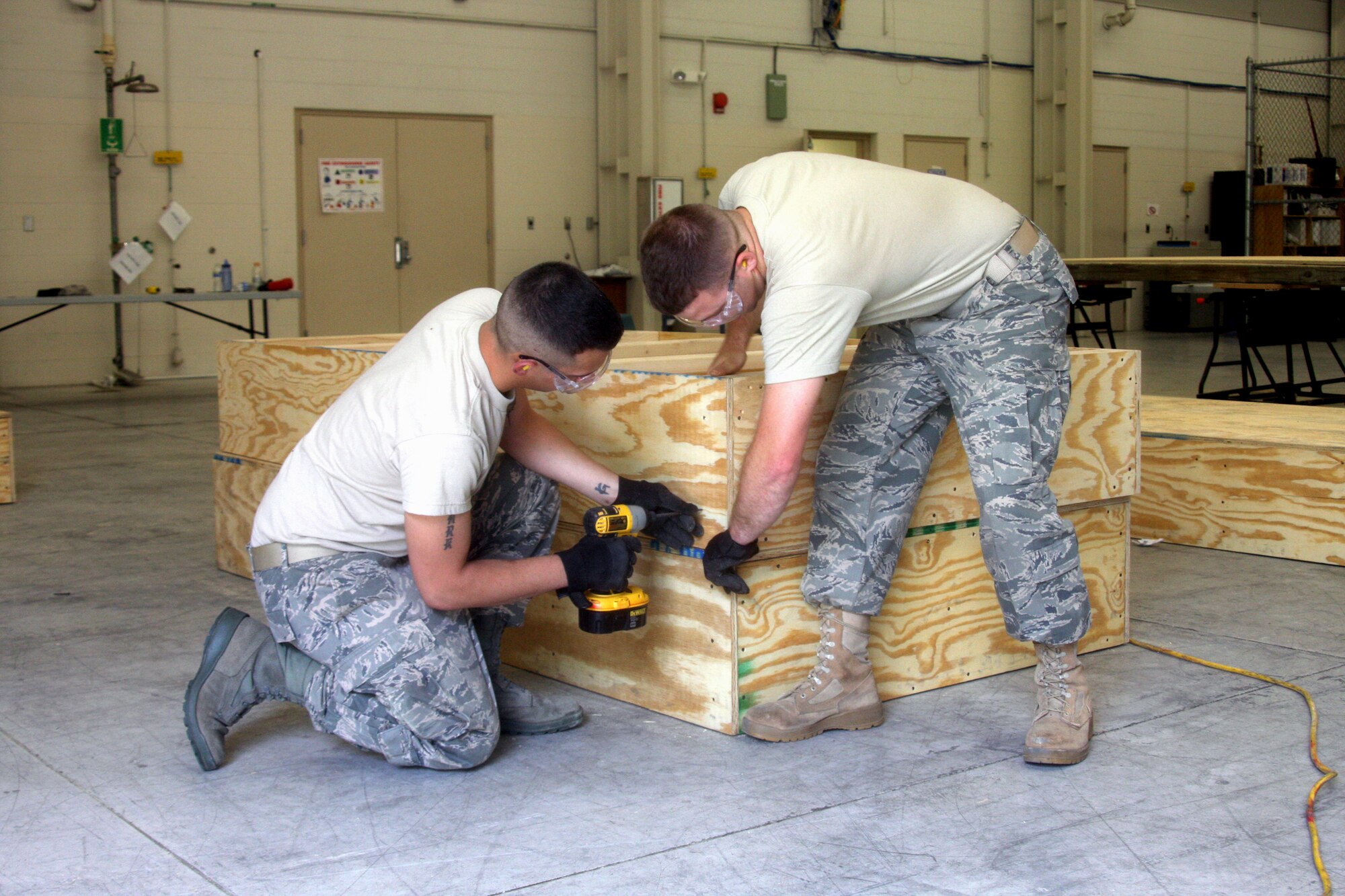 WRIGHT-PATTERSON AIR FORCE BASE, Ohio – Staff Sgt. Bryan Grimm and Airman Kerry Gastaldo, both from the 445th Civil Engineer Squadron, build a portable stage as part of their training during the May 16 unit training assembly.  The portable stage will be used for future squadron events. (U.S. Air Force photo/Senior Airman Mikhail Berlin)