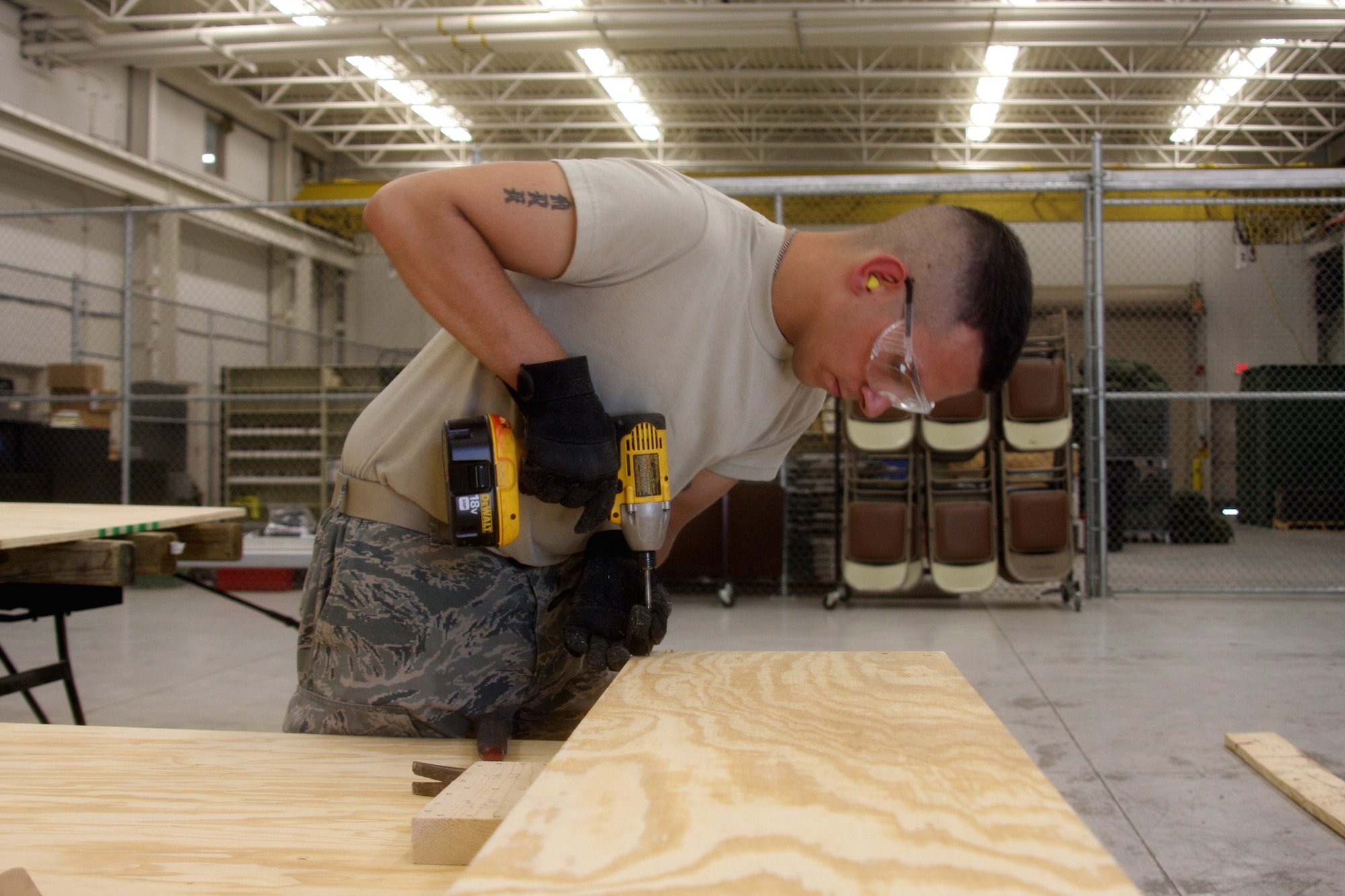 WRIGHT-PATTERSON AIR FORCE BASE, Ohio - Airman Kerry Gastaldo, 445th Civil Engineer Squadron, builds a portable stage as part of his training during the May 16 unit training assembly.  The portable stage will be used for future squadron events. (U.S. Air Force photo/Senior Airman Mikhail Berlin)
