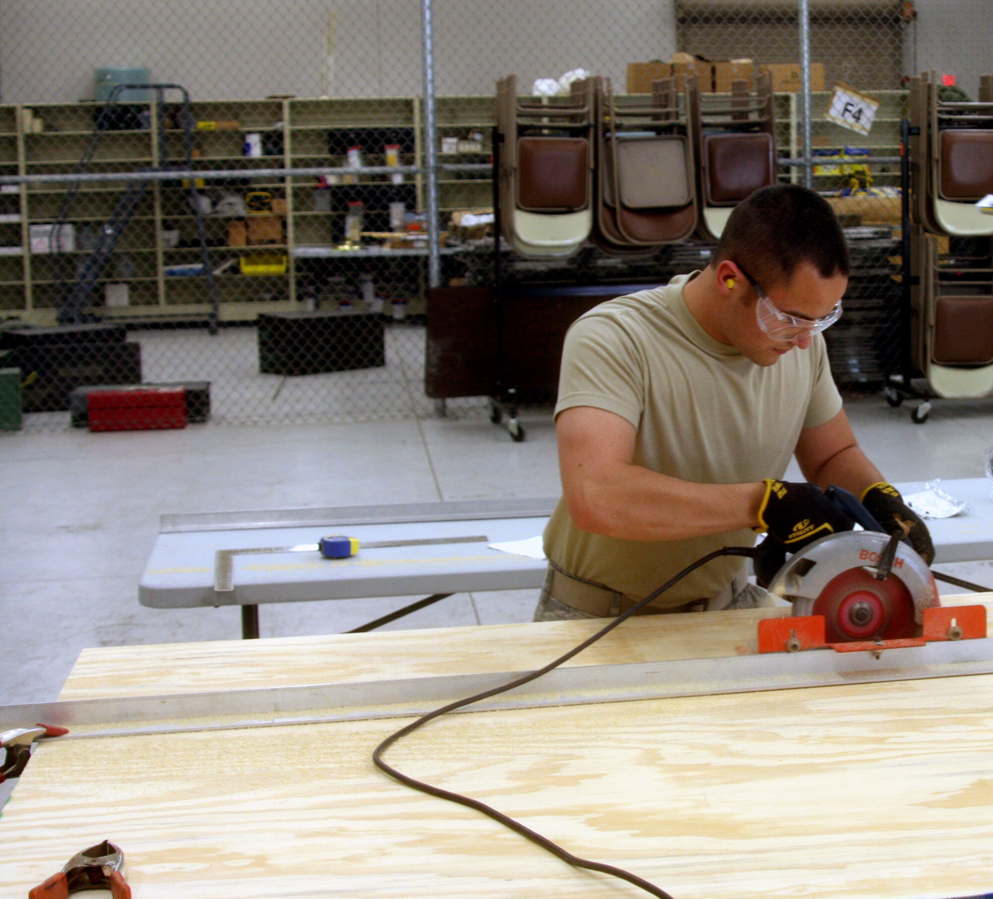 WRIGHT-PATTERSON AIR FORCE BASE, Ohio - Senior Airman Luke Gourley, 445th Civil Engineer Squadron, builds a portable stage as part of his training during the May 16 unit training assembly.  The portable stage will be used for future squadron events. (U.S. Air Force photo/Senior Airman Mikhail Berlin)