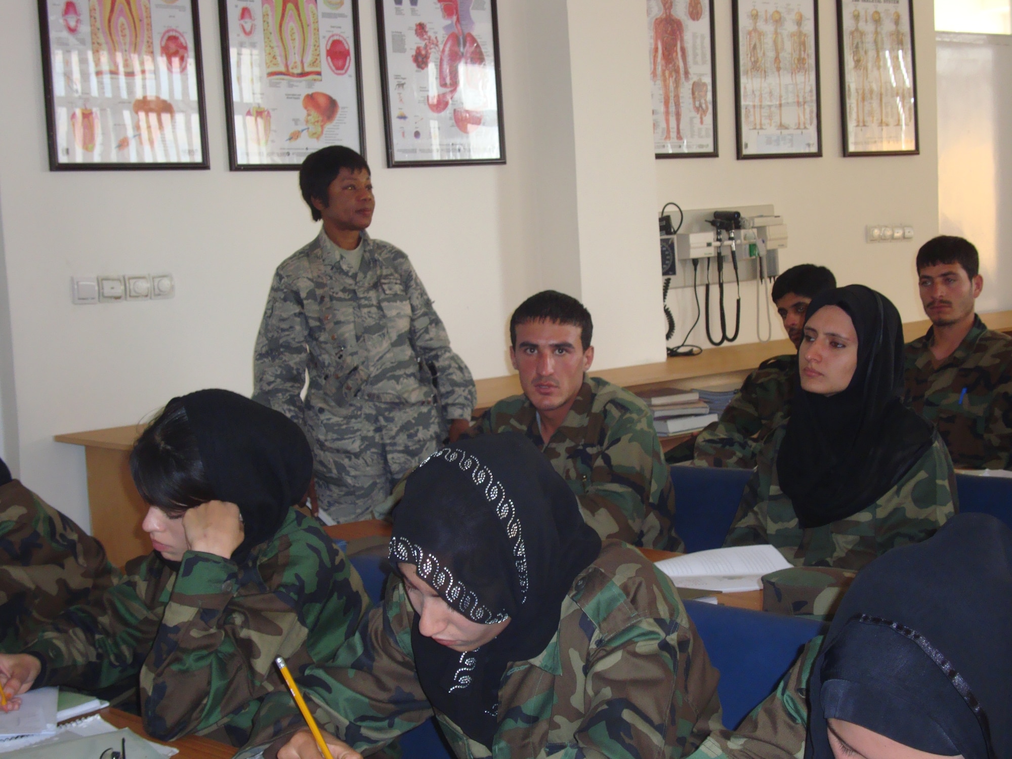 Lt . Col. Bernadette Anderson, 61st Medical Group, teaches nursing to a group Afghan nursing students during her deployment. The program trains students in adult, pediatrics, maternal-child, trauma, mental health and geriatrics nursing.  (Courtesy Photo) 