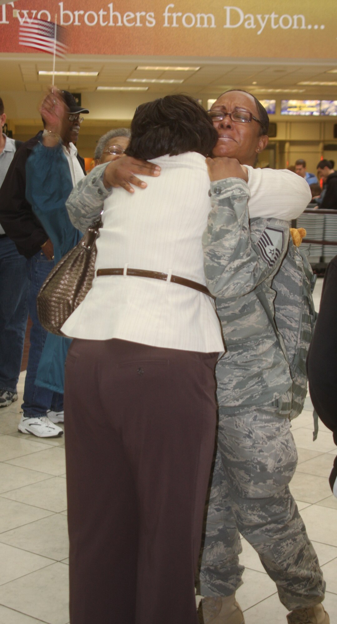 WRIGHT-PATTERSON AIR FORCE BASE, Ohio – Master Sgt. Leegurtha Lucas, 445th Mission Support Flight, is greeted by family and friends at the Dayton International Airport May 17 after returning from a 120-day deployment to Bagram Air Base, Afghanistan. Sergeant Lucas was assigned to the 755th Air Expeditionary Group where she was a knowledge operations manager assigned as the non-commissioned officer in charge of the knowledge management section.  (U.S. Air Force photo/Stacy Vaughn)