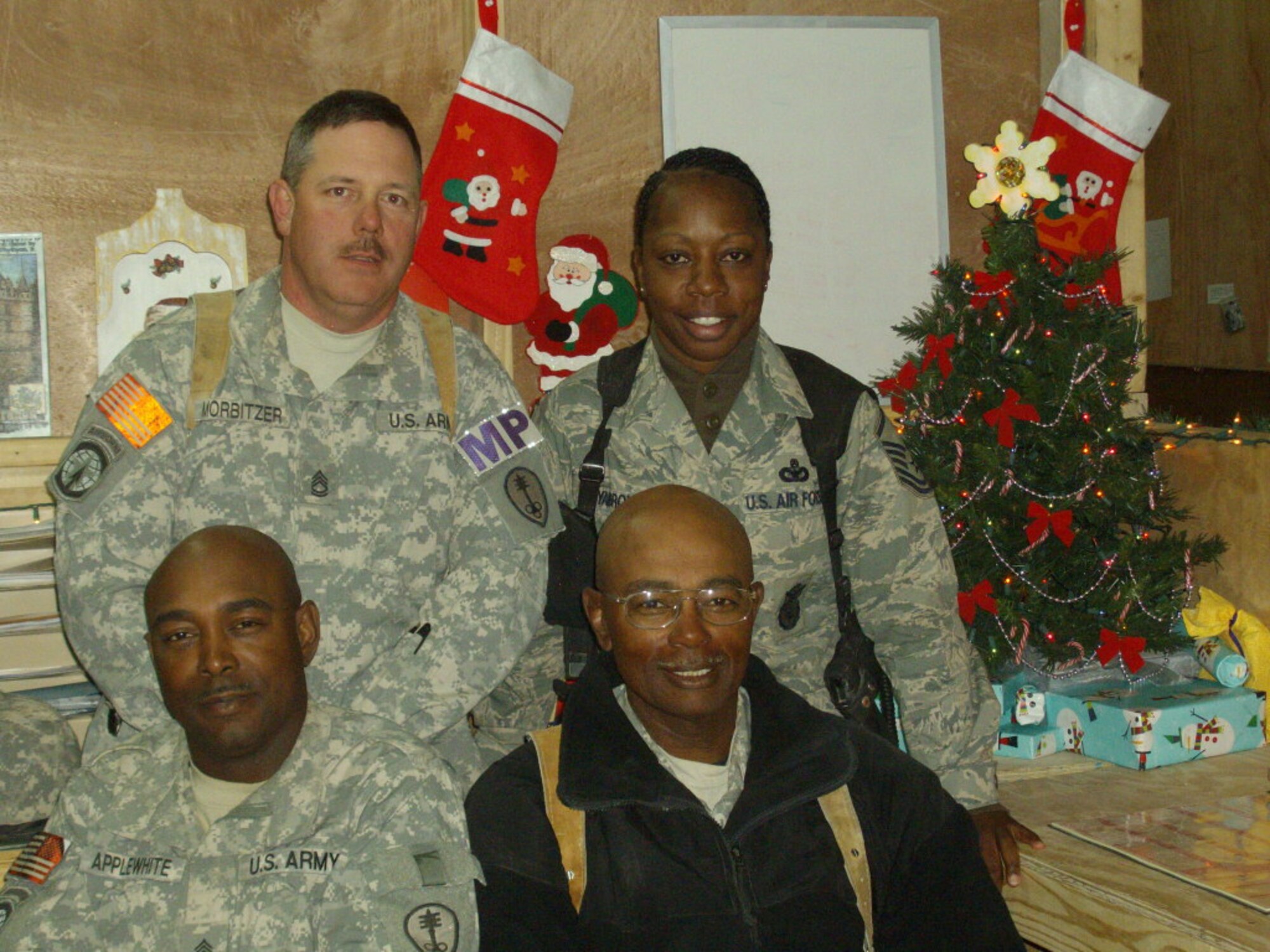 BARKSDALE AIR FORCE BASE, La. – Master Sgt. Keisha Yarbrough, top right, stops for a quick holiday picture with her fellow deployed servicemembers in December 2008. Sergeant Yarbrough was recently honored as the 2009 Air Force Global Strike Command First Sergeant and Outstanding Airman of the Year.  (Courtesy Photo)