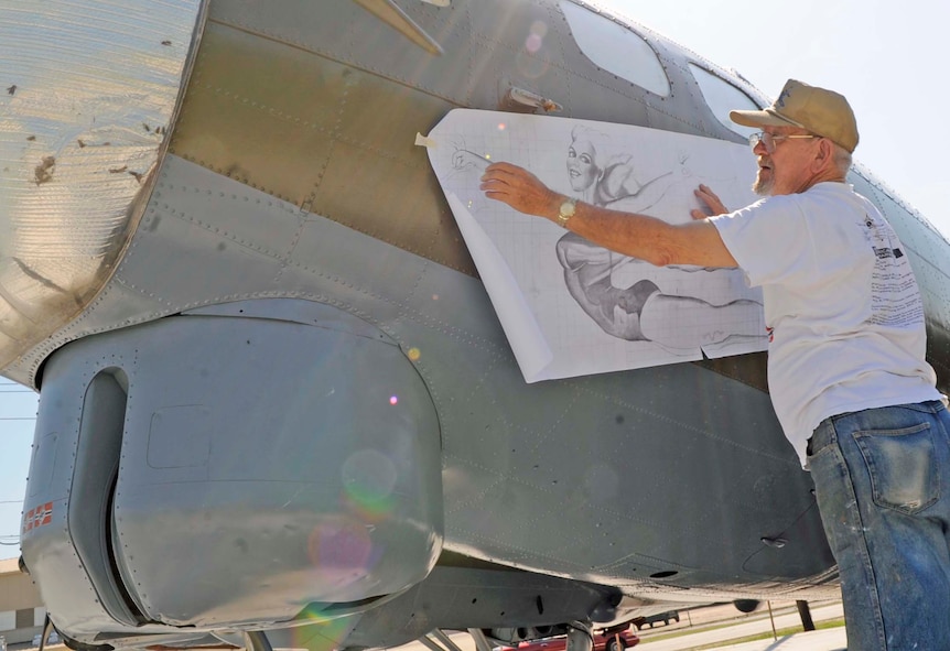 BARKSDALE AIR FORCE BASE, La. -- Ron Fountain, Houston’s Southwest Museum Services development director, prepares to paint "Miss Liberty" on the nose of a B-17G at the Eighth Air Force museum May 18. The near-complete paint job mirrors a B-17G that was flown by Maj. Gen. Lewis E. Lyle, who flew many missions in B-17s during World War II. (U.S. Air Force photo/Staff Sgt. John Gordinier)