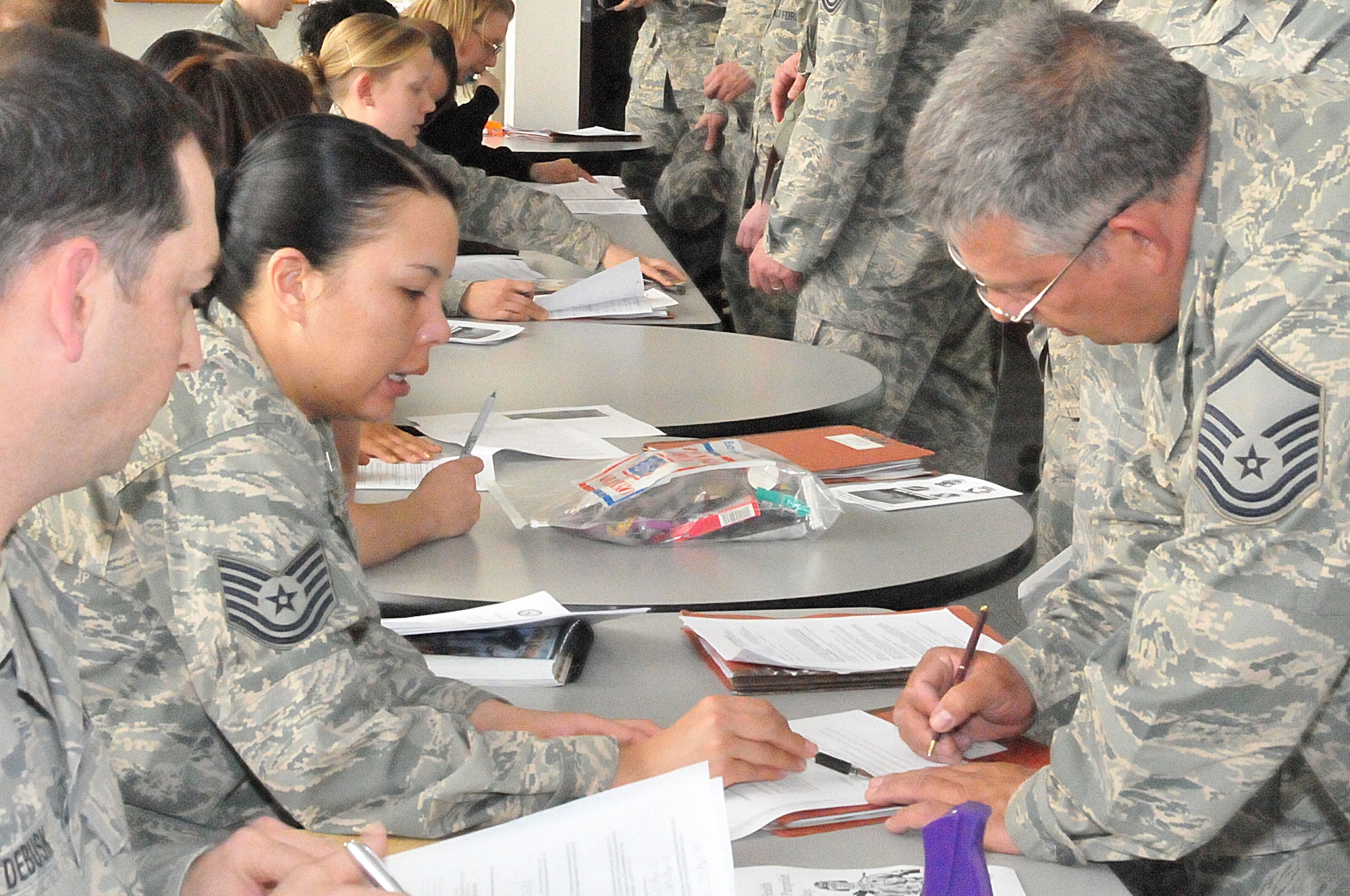 Master Sgt. John Maslanka, a crew chief with the 126th Aircraft Maintenance Squadron, receives a medical briefing from Technical Sgt. Lisa Oliver, a public health technician with the 126th Medical Group. The Illinois Air National Guardsman deployed in support of Operation Enduring Freedom from the 126th Air Refueling Wing located at Scott AFB, Ill. (U.S. Air Force photo by MSgt Franklin Hayes) (Released)