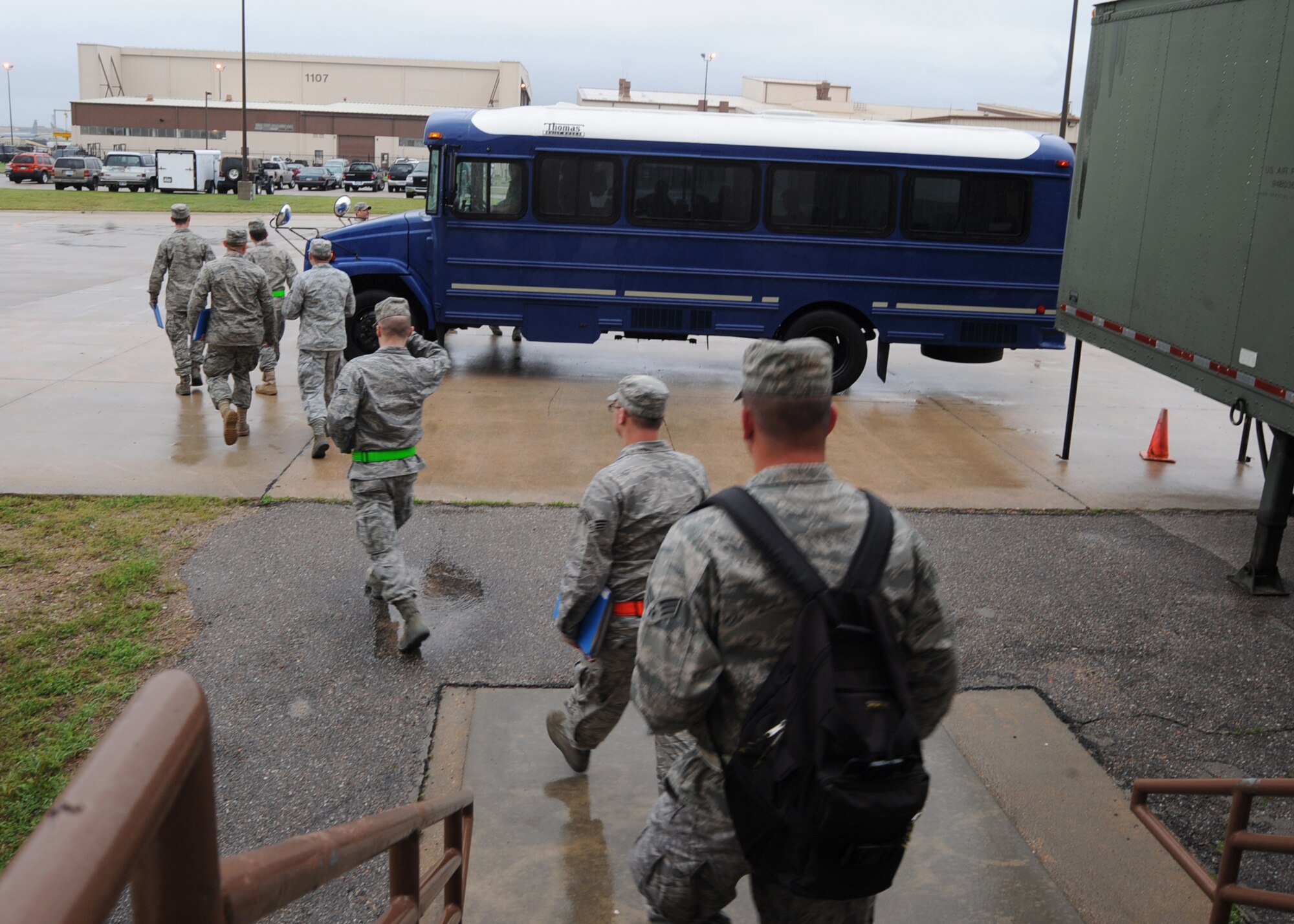 Team McConnell Airmen approach a bus for transportation to an aircraft for a simulated flight during an operational readiness exercise May 19, 2010, McConnell Air Force Base, Kan. The exercise simulated the deployment of more than 200 Airmen and 187 short tons of equipment to a forward operating base. (U.S. Air Force photo/Senior Airman Maria Ruiz) 