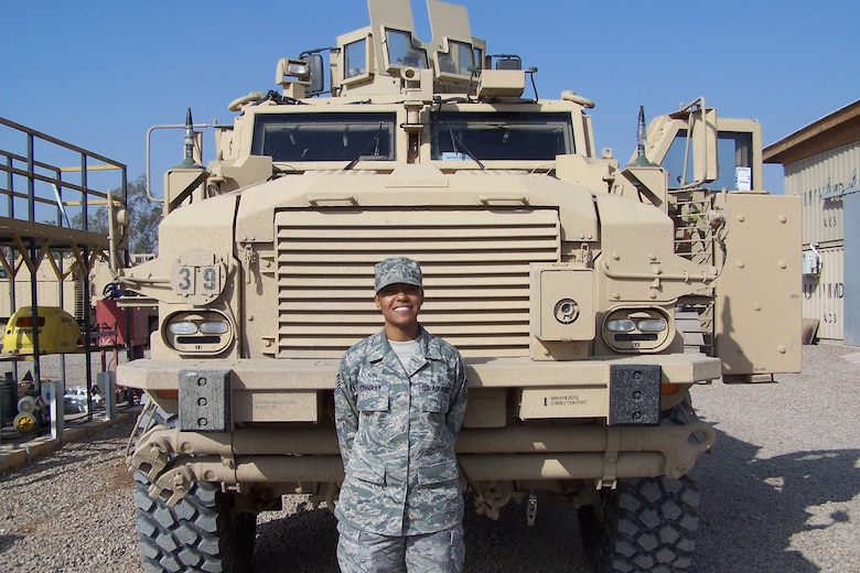 Tech. Sgt. Erin Connolly, 509th Medical Operations Squadron bioenvironmental technician, stands in front of the newest mine resistant ambush protected vehicle, which arrived in Iraq, Dec. 1, 2009. 